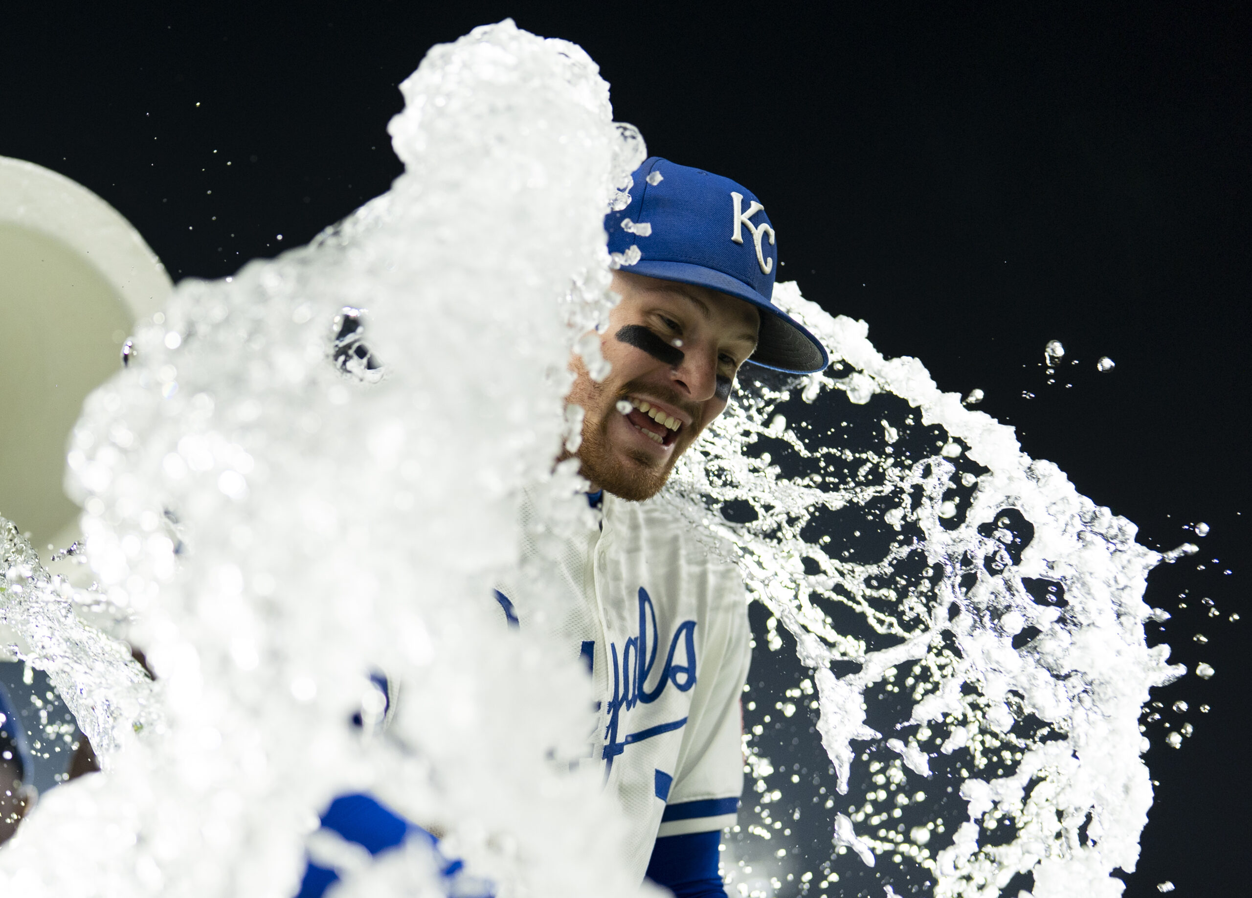 Sep 4, 2025; Kansas City, Missouri, USA; Kansas City Royals shortstop Bobby Witt Jr. (7) is doused by center fielder Kyle Isbel (28) and second baseman Tyler Tolbert (2) after defeating the Los Angeles Angels at Kauffman Stadium. Mandatory Credit: Jay Biggerstaff-Imagn Images