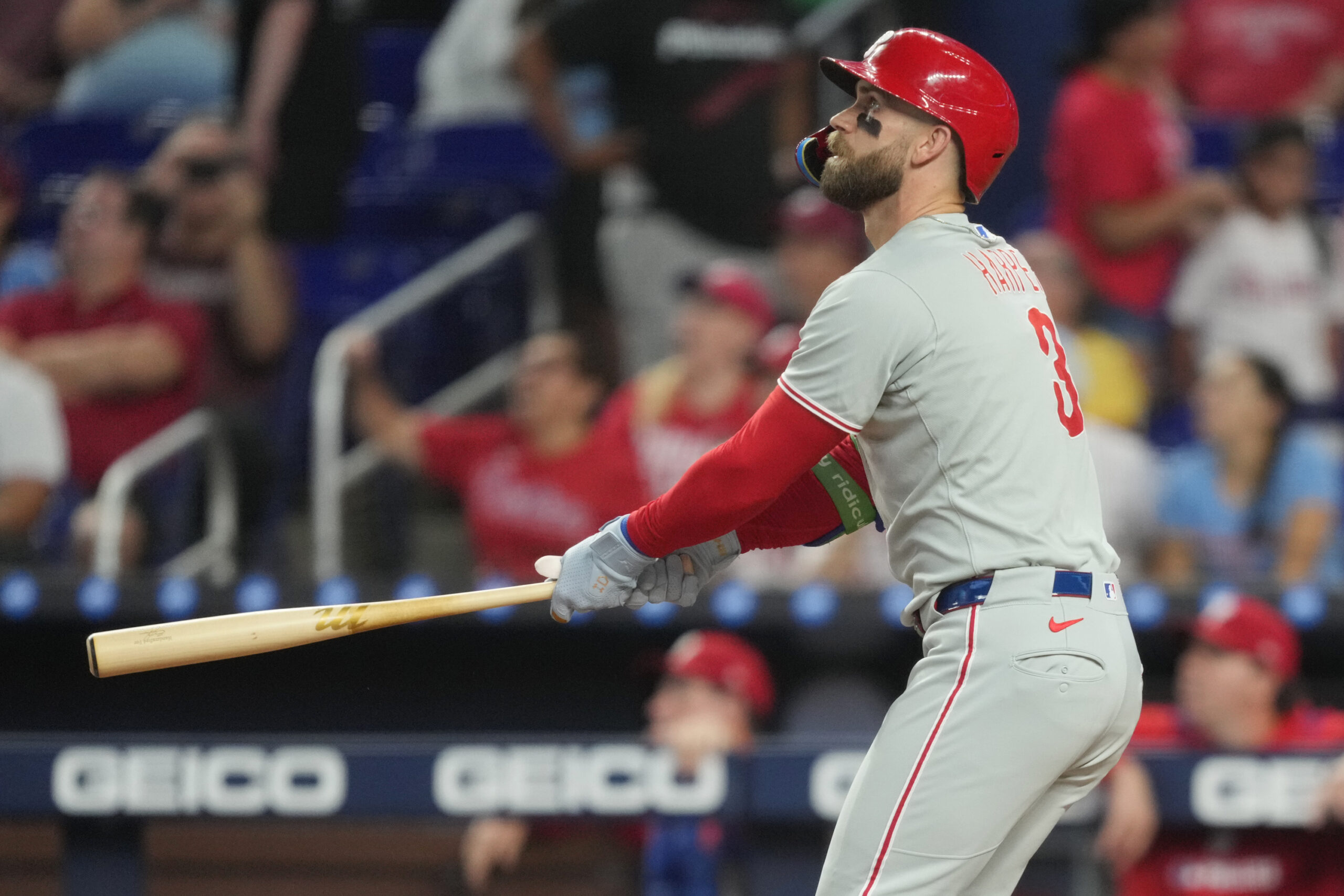 Sep 6, 2025; Miami, Florida, USA;  Philadelphia Phillies first baseman Bryce Harper (3) hits a two-run home run in the first inning against the Miami Marlins at loanDepot Park. Mandatory Credit: Jim Rassol-Imagn Images