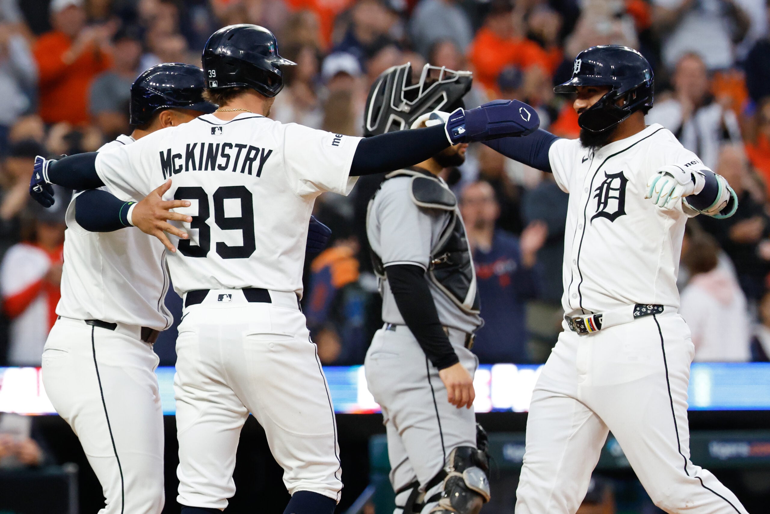Sep 6, 2025; Detroit, Michigan, USA;  Detroit Tigers second base Gleyber Torres (25) celebrates with designated hitter Jahmai Jones (18) and third base Zach McKinstry (39) after he hits a three run home run in the fourth inning against the Chicago White Sox at Comerica Park. Mandatory Credit: Rick Osentoski-Imagn Images