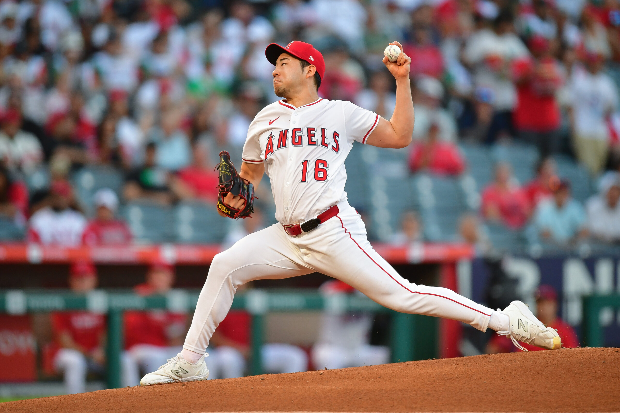 Sep 6, 2025; Anaheim, California, USA; Los Angeles Angels pitcher Yusei Kikuchi (16) throws against the Athletics during the first inning at Angel Stadium. Kikuchi records his 1000th career strike out against Athletics designated hitter Brent Rooker (25). Mandatory Credit: Gary A. Vasquez-Imagn Images