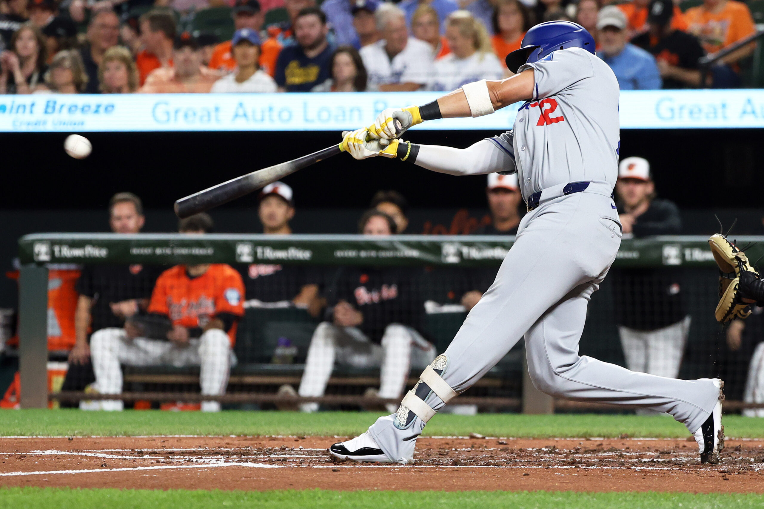 Sep 6, 2025; Baltimore, Maryland, USA; Los Angeles Dodgers second baseman Miguel Rojas (72) hits a double during the third inning against the Baltimore Orioles at Oriole Park at Camden Yards. Mandatory Credit: Daniel Kucin Jr.-Imagn Images