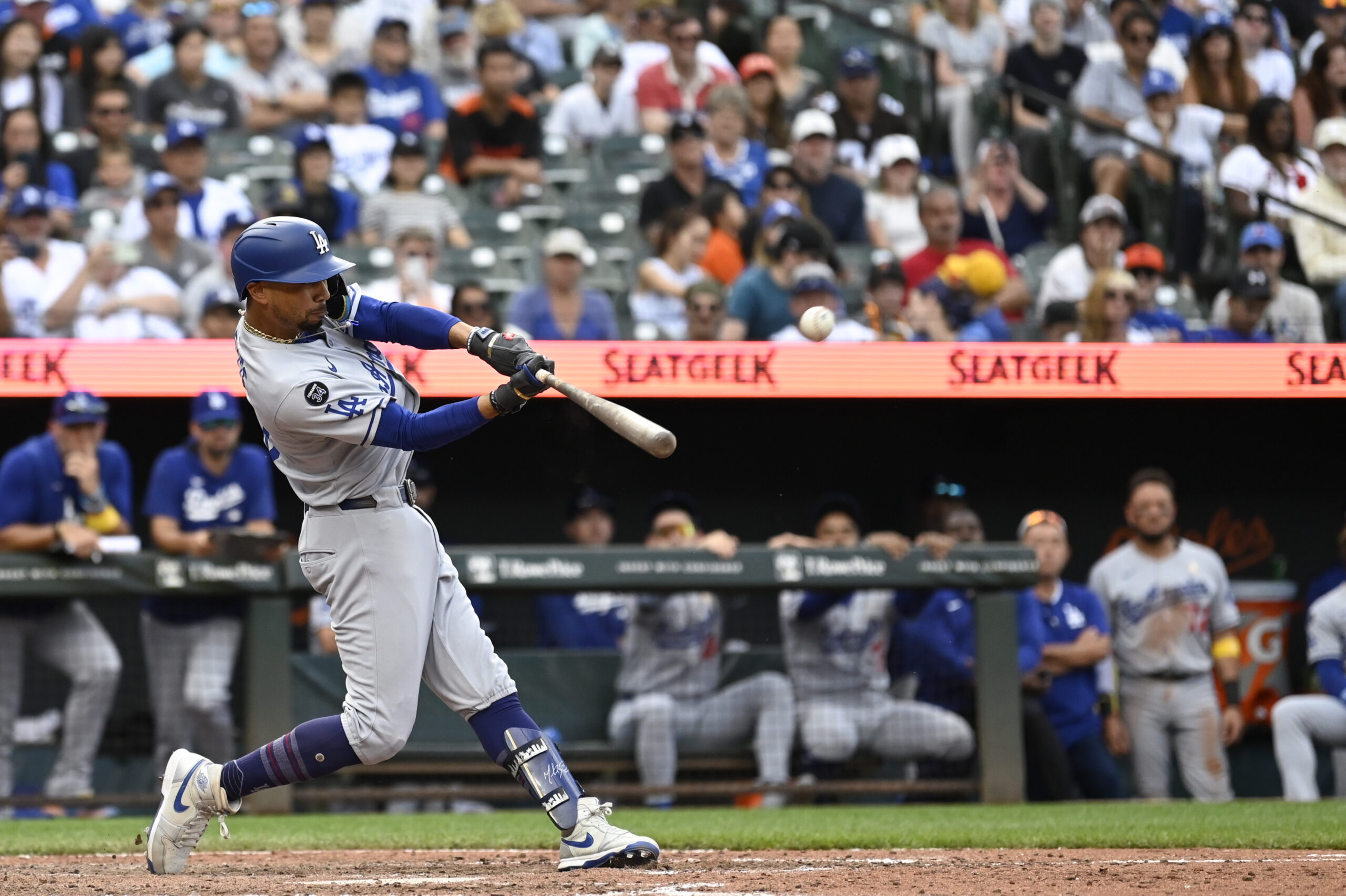 Sep 7, 2025; Baltimore, Maryland, USA;  Los Angeles Dodgers shortstop Mookie Betts (50) hits a rbi single in the ninth inning against the Baltimore Orioles  at Oriole Park at Camden Yards. Mandatory Credit: Tommy Gilligan-Imagn Images