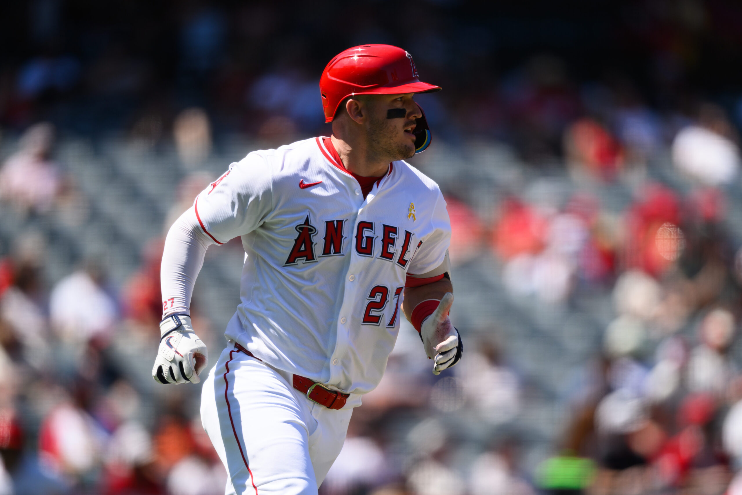 Sep 7, 2025; Anaheim, California, USA; Los Angeles Angels designated hitter Mike Trout (27) runs after hitting a double against the Athletics during the third inning at Angel Stadium. Mandatory Credit: William Liang-Imagn Images
