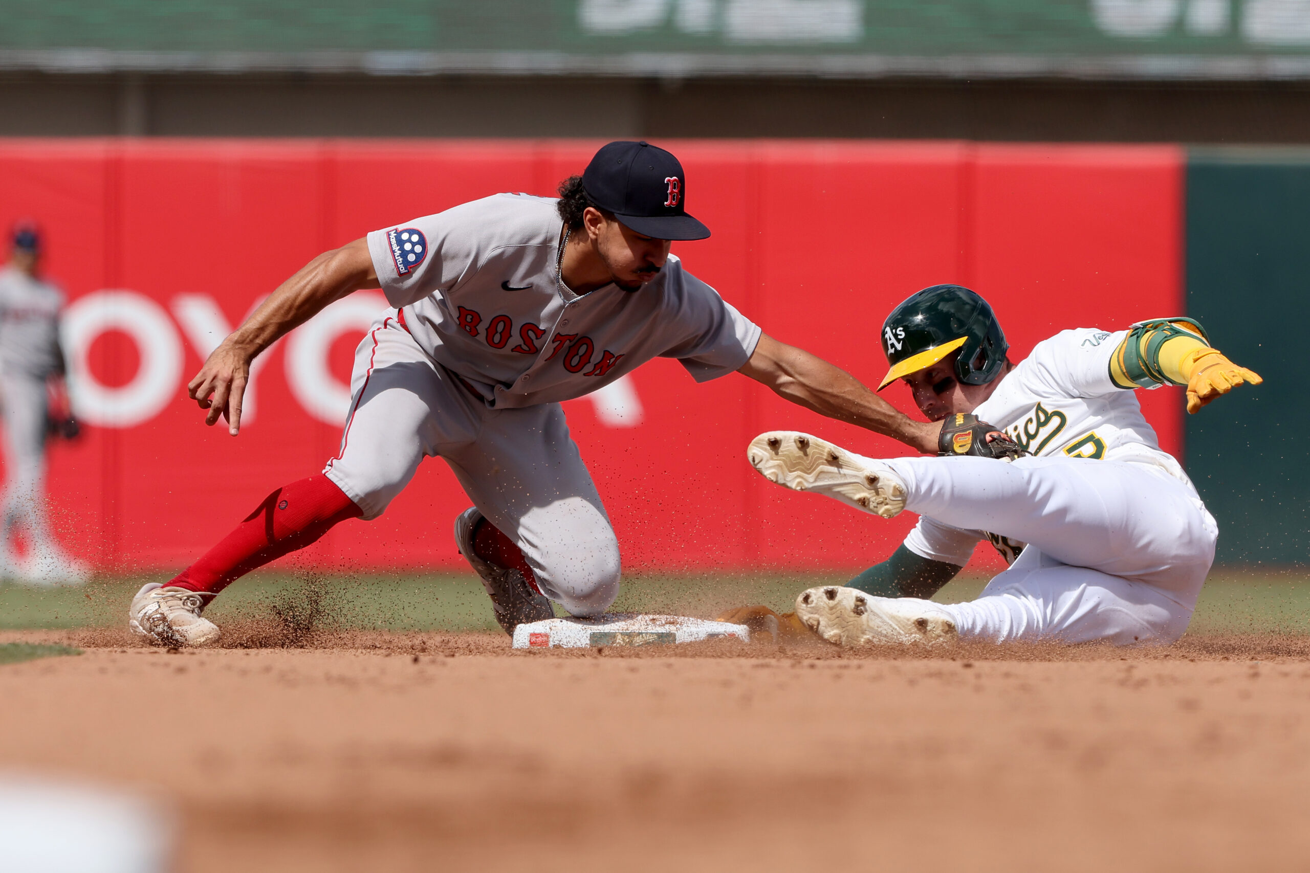 Sep 10, 2025; West Sacramento, California, USA; Athletics right fielder Brent Rooker (25) slides ahead of the tag from Boston Red Sox second baseman David Hamilton (17) during the fifth inning at Sutter Health Park. Mandatory Credit: Dennis Lee-Imagn Images