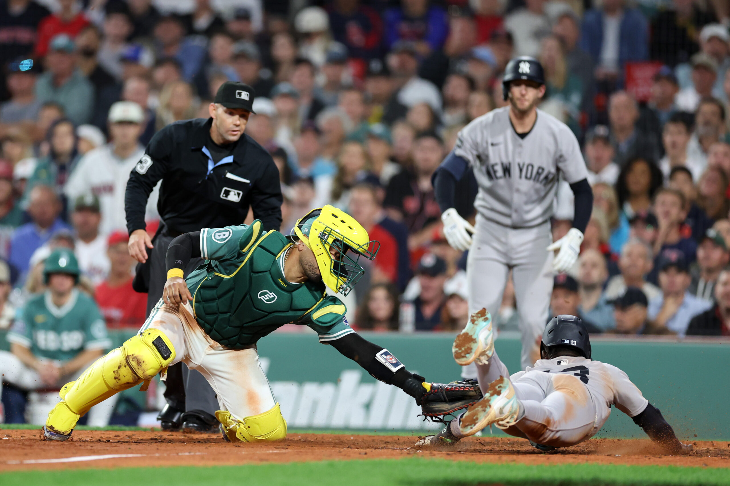 Sep 12, 2025; Boston, Massachusetts, USA; Boston Red Sox catcher Carlos Narvaez (75) tags out New York Yankees second baseman Jazz Chisholm Jr (13) during the eighth inning at Fenway Park. Mandatory Credit: Paul Rutherford-Imagn Images