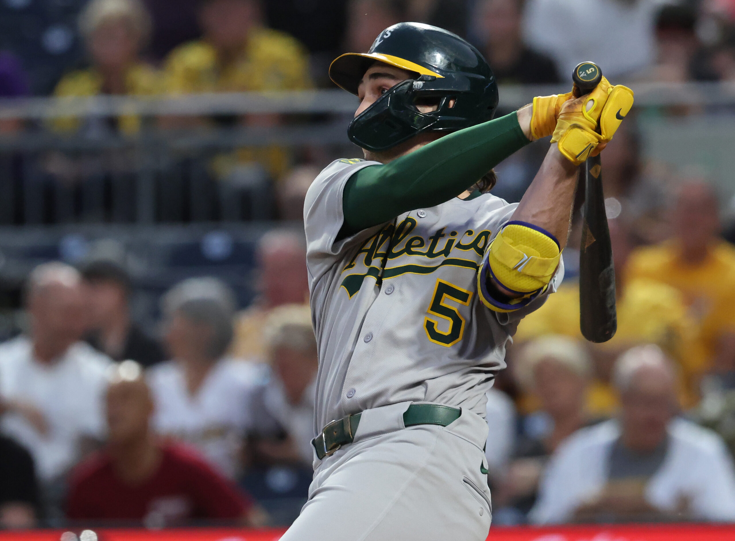 Sep 20, 2025; Pittsburgh, Pennsylvania, USA;  Athletics shortstop Jacob Wilson (5) hits a double against the Pittsburgh Pirates during the second inning at PNC Park. Mandatory Credit: Charles LeClaire-Imagn Images