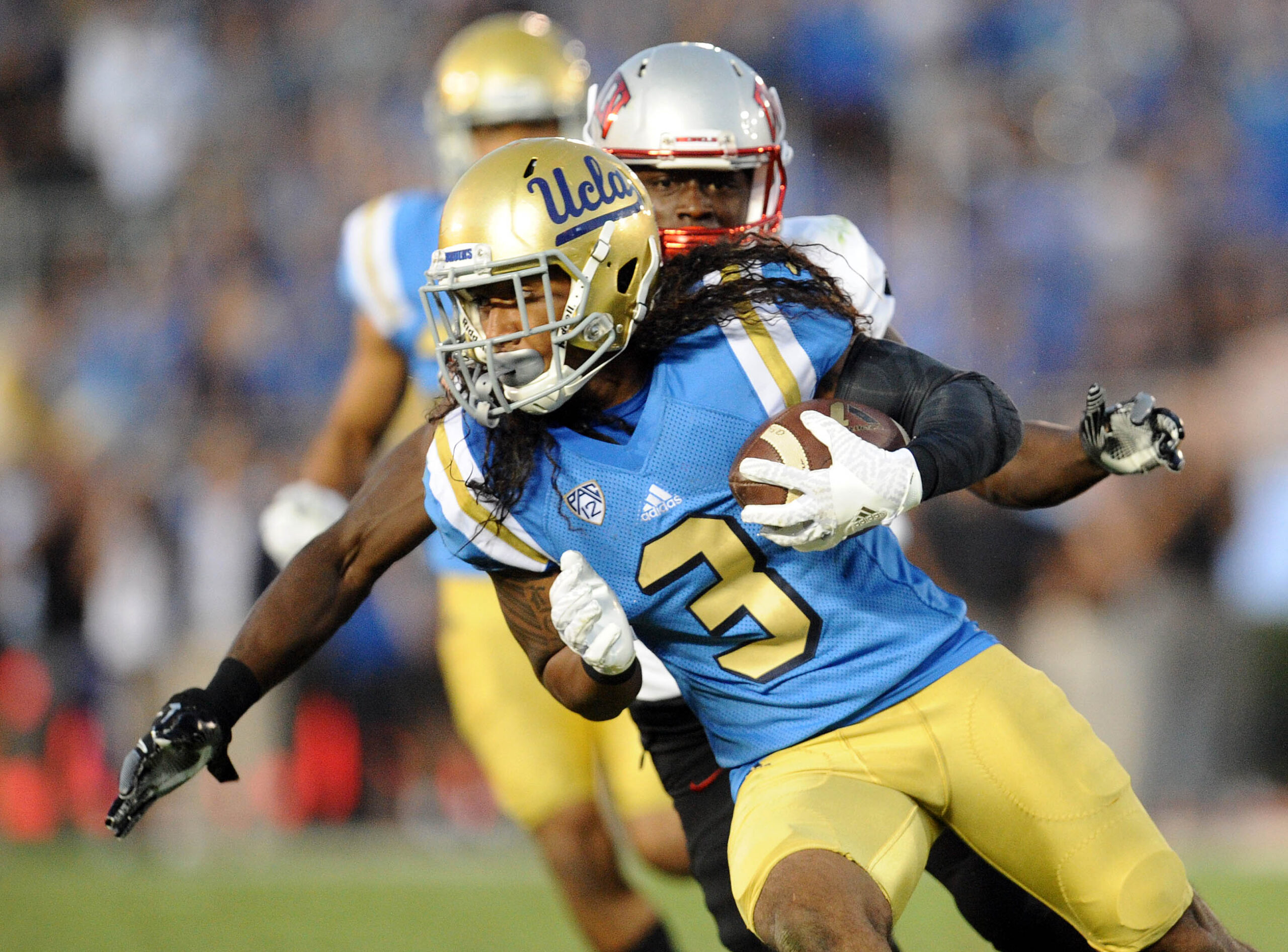 September 10, 2016; Pasadena, CA, USA;  UCLA Bruins defensive back Randall Goforth (3) carries the ball after intercepting a pass against the UNLV Rebels during the second half at Rose Bowl. Mandatory Credit: Gary A. Vasquez-Imagn Images
