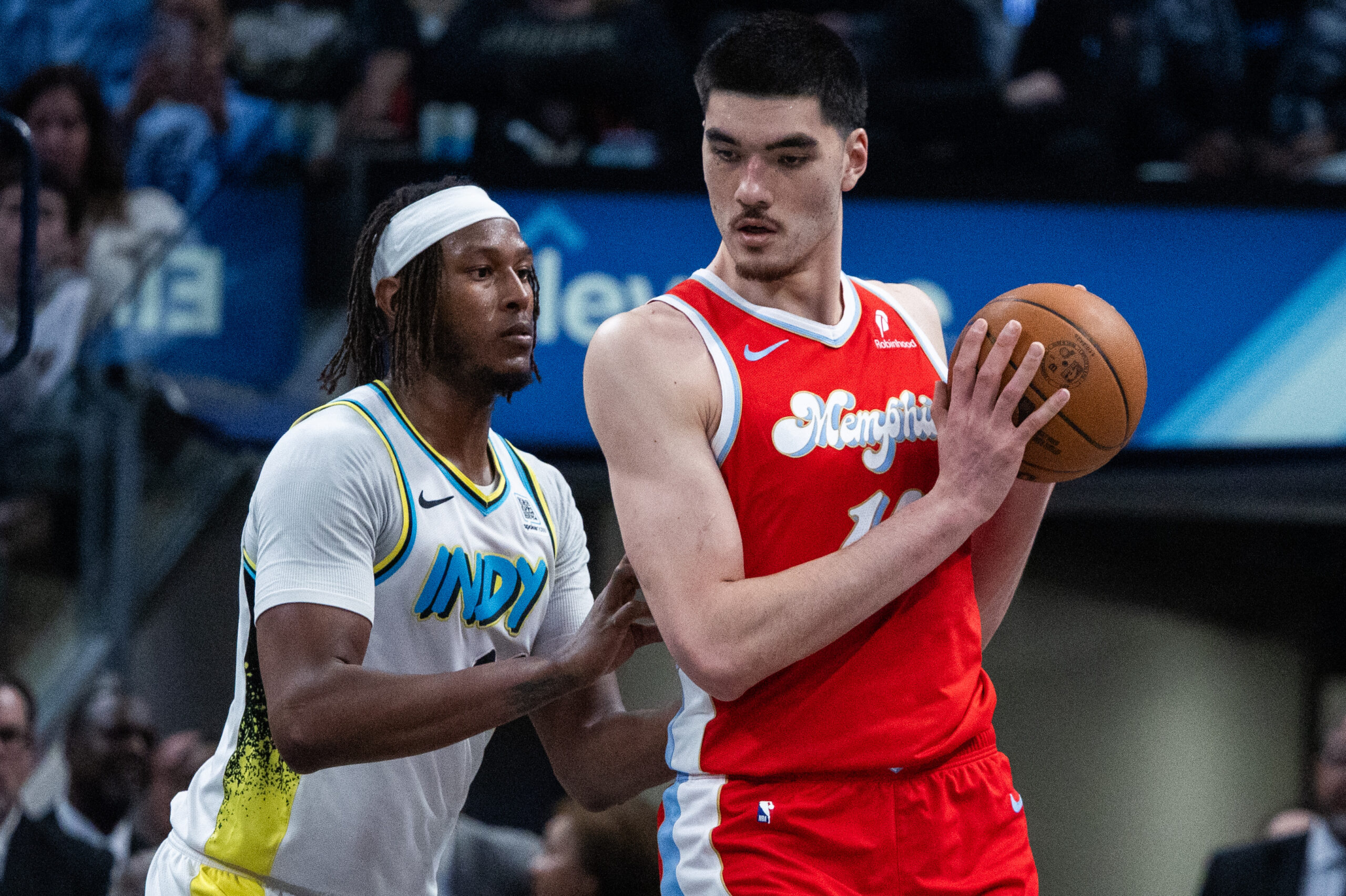Feb 20, 2025; Indianapolis, Indiana, USA; Memphis Grizzlies center Zach Edey (14) holds  the ball while Indiana Pacers center Myles Turner (33)  defends in the second half at Gainbridge Fieldhouse. Mandatory Credit: Trevor Ruszkowski-Imagn Images