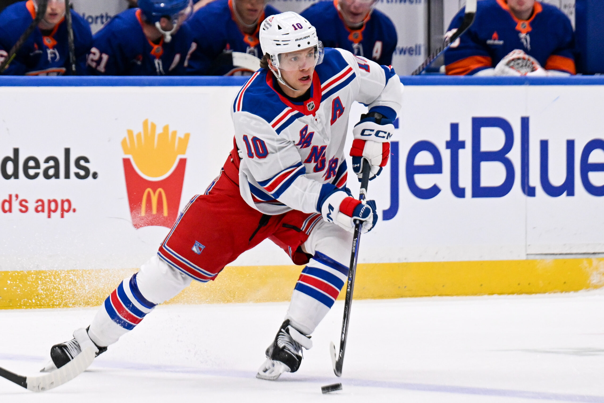Apr 10, 2025; Elmont, New York, USA;  New York Rangers left wing Artemi Panarin (10) skates across the blue against the New York Islanders during the first period at UBS Arena. Mandatory Credit: Dennis Schneidler-Imagn Images