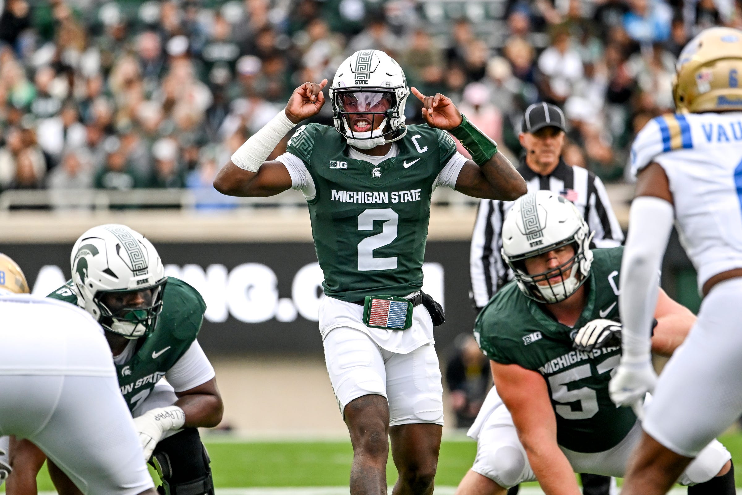 Michigan State's Aidan Chiles prepares for the snap against UCLA during the first quarter on Saturday, Oct. 11, 2025, at Spartan Stadium in East Lansing.