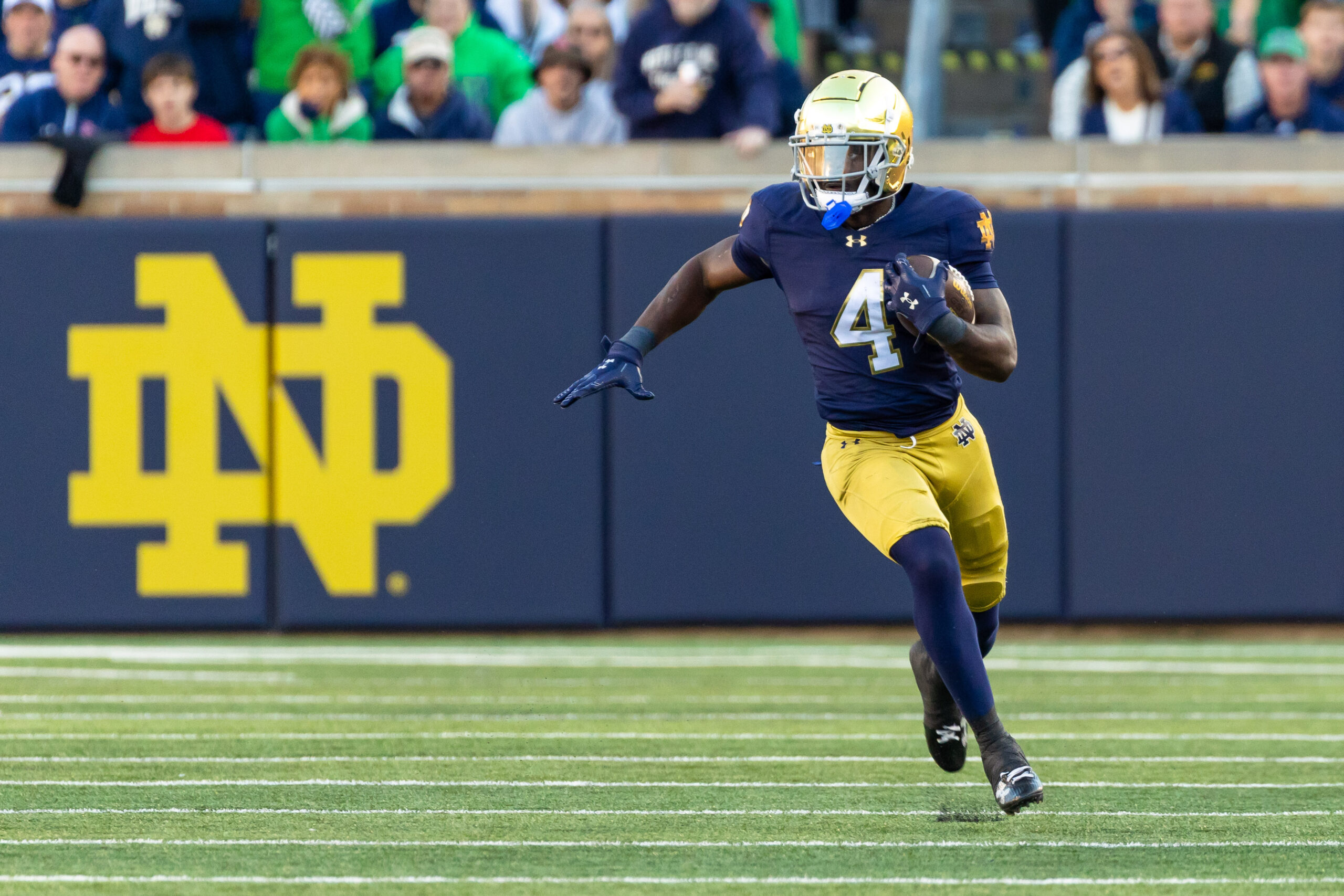 Oct 11, 2025; South Bend, Indiana, USA; Notre Dame Fighting Irish running back Jeremiyah Love (4) runs the ball against the NC State Wolfpack during the second half at Notre Dame Stadium. Mandatory Credit: Michael Caterina-Imagn Images