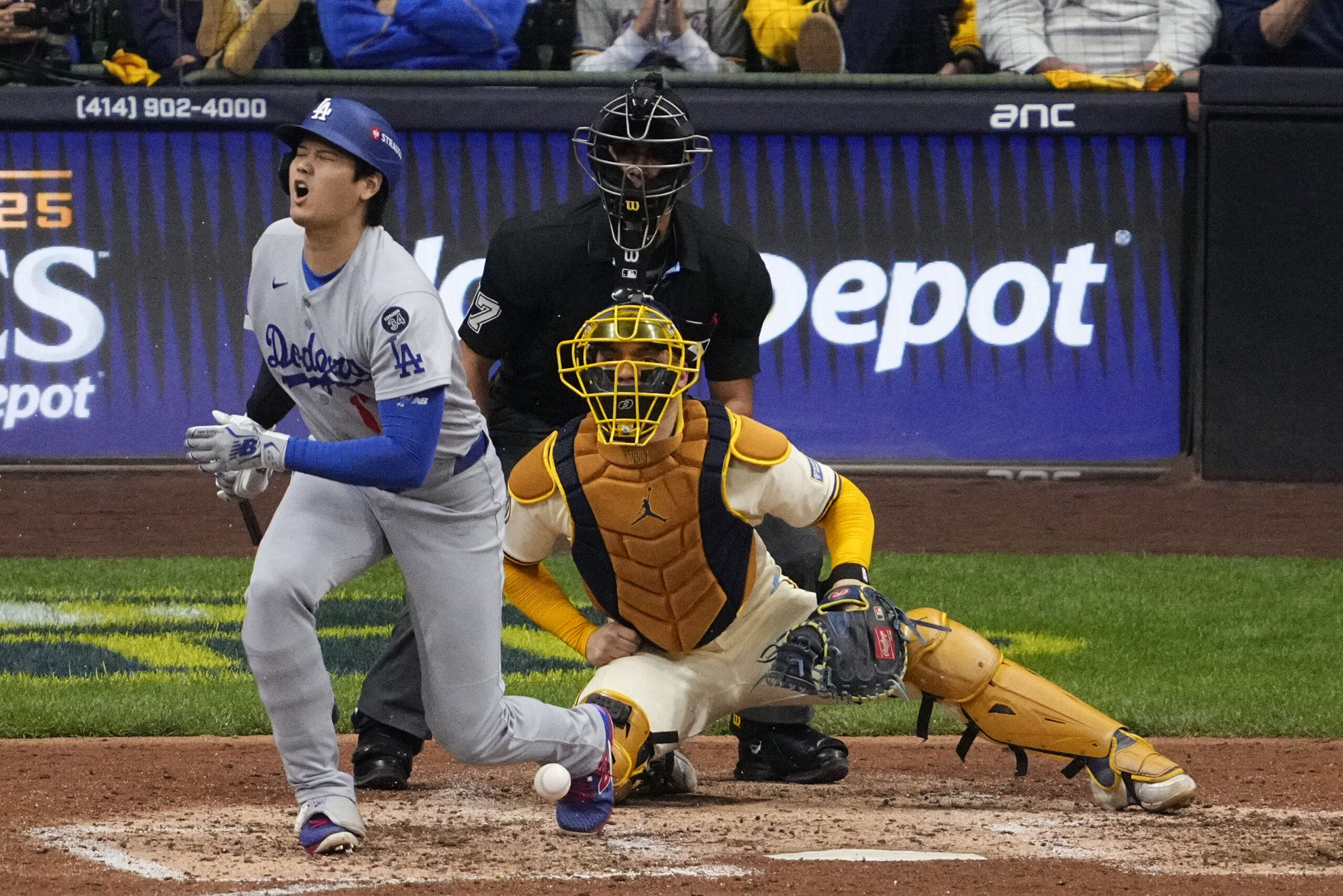 Oct 14, 2025; Milwaukee, Wisconsin, USA; Los Angeles Dodgers two-way player Shohei Ohtani (17) fouls a ball off his leg in the seventh inning during game two of the NLCS round for the 2025 MLB playoffs at American Family Field. Mandatory Credit: Michael McLoone-Imagn Images