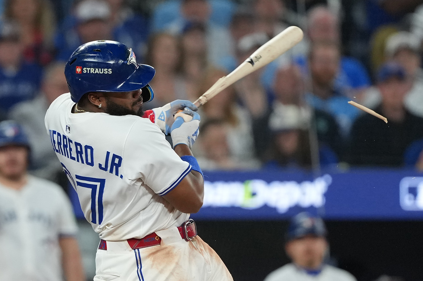 Oct 19, 2025; Toronto, Ontario, CAN; Toronto Blue Jays first baseman Vladimir Guerrero Jr. (27) singles in the eighth inning against the Seattle Mariners during game six of the ALCS round for the 2025 MLB playoffs at Rogers Centre. Mandatory Credit: Nick Turchiaro-Imagn Images