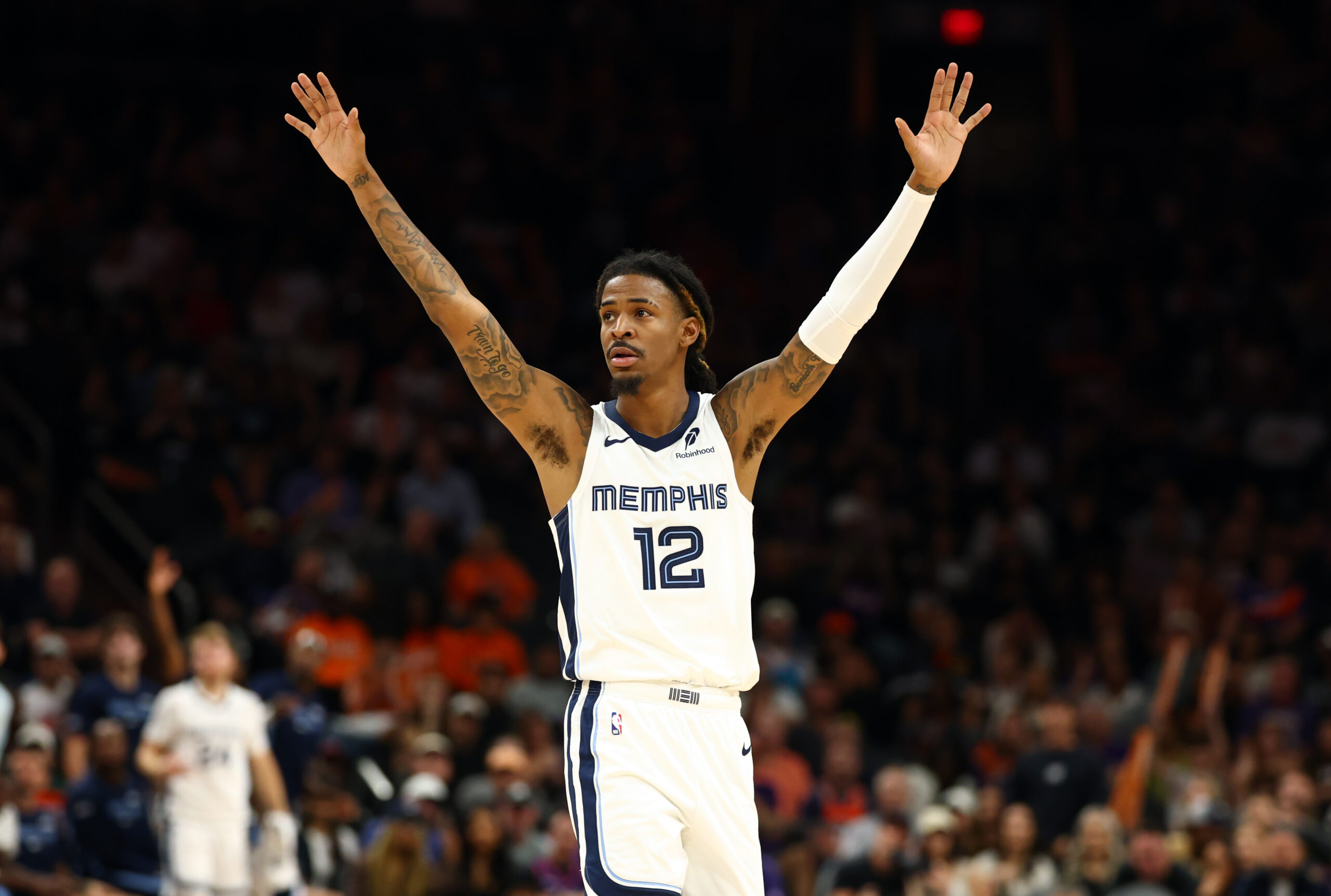 Oct 29, 2025; Phoenix, Arizona, USA; Memphis Grizzlies guard Ja Morant (12) reacts against the Phoenix Suns during the second half at the Mortgage Matchup Center. Mandatory Credit: Mark J. Rebilas-Imagn Images