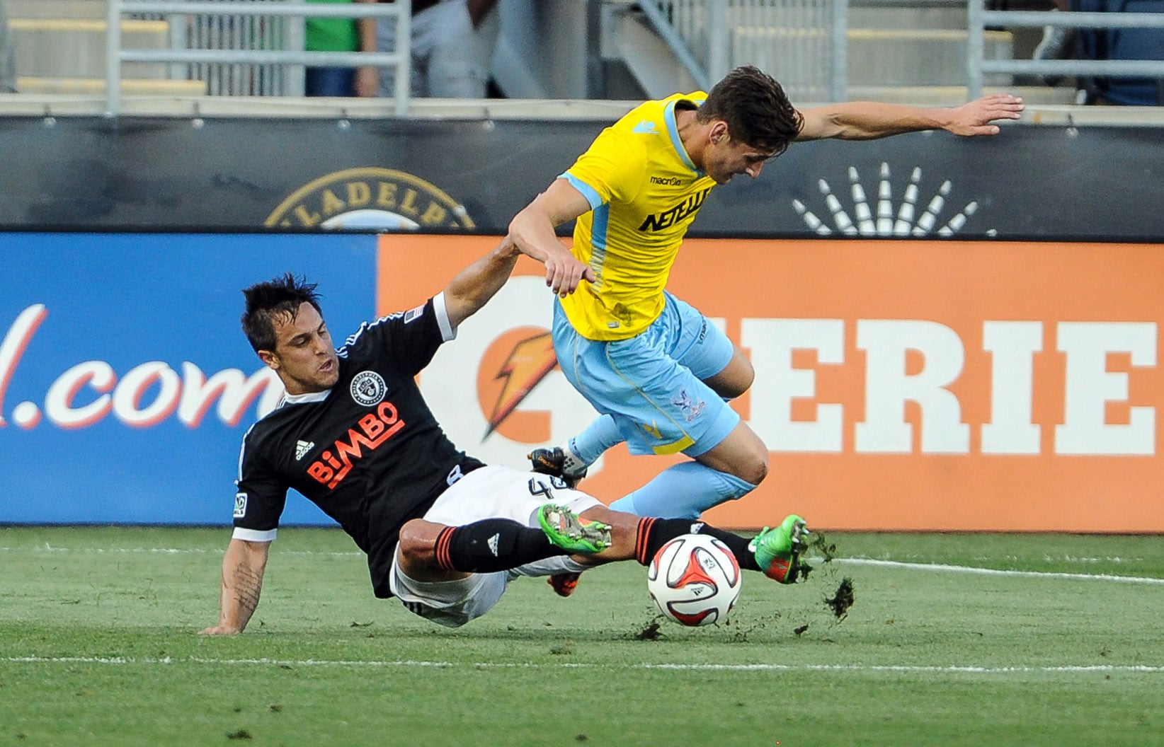 Jul 25, 2014; Chester, PA, USA; Philadelphia Union defender/midfielder Danny Cruz (44) collides with Crystal Palace defender Joel Ward (2) during the first half of the match at PPL Park. Mandatory Credit: John Geliebter-Imagn Images