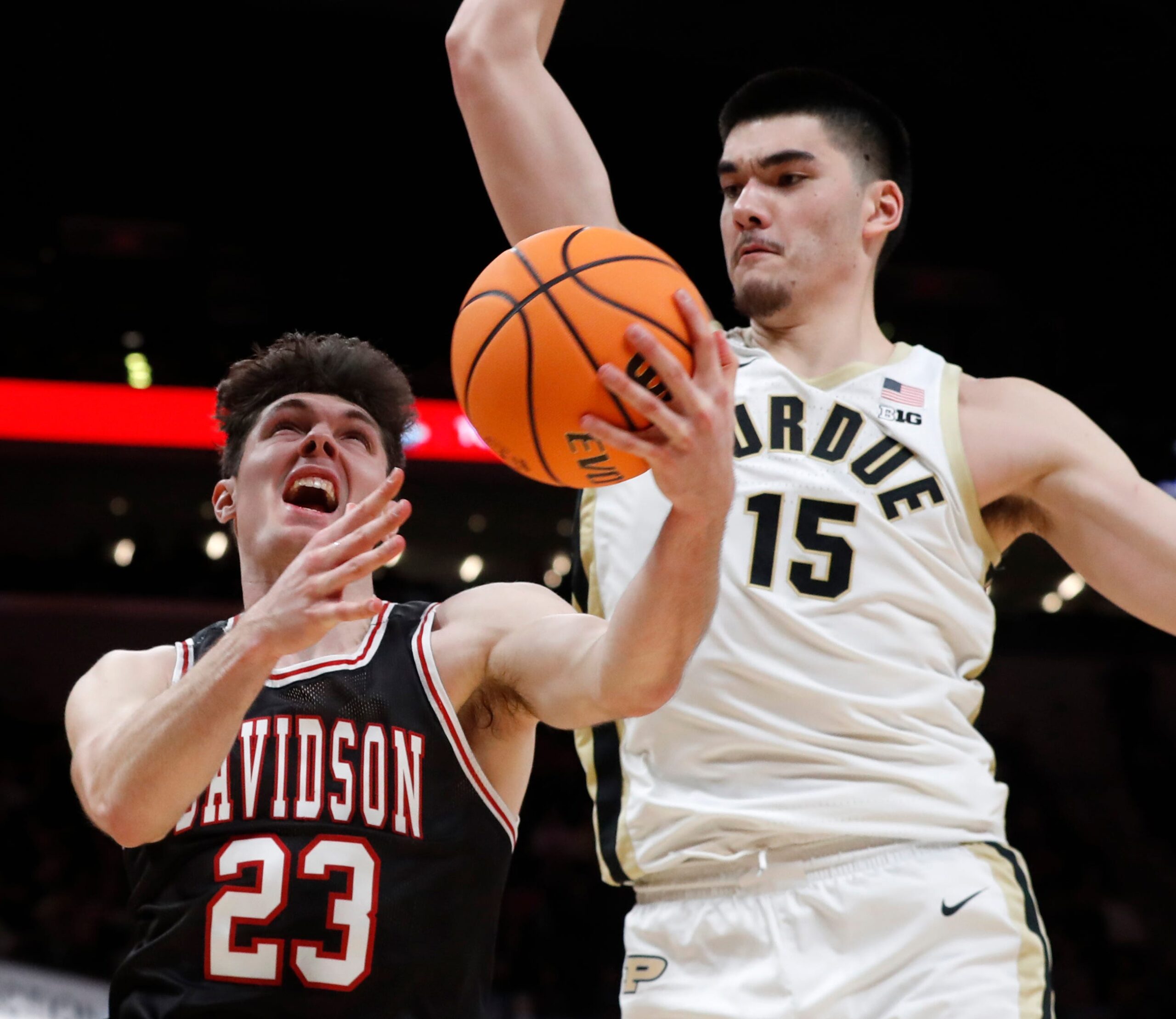 Purdue Boilermakers center Zach Edey (15) fouls Davidson Wildcats guard Connor Kochera (23) during the Indy Classic NCAA men   s basketball doubleheader, Saturday, Dec. 17, 2022, at Gainbridge Fieldhouse in Indianapolis. Purdue won 69-61.

Purduedavidsonmbb121722 Am14258