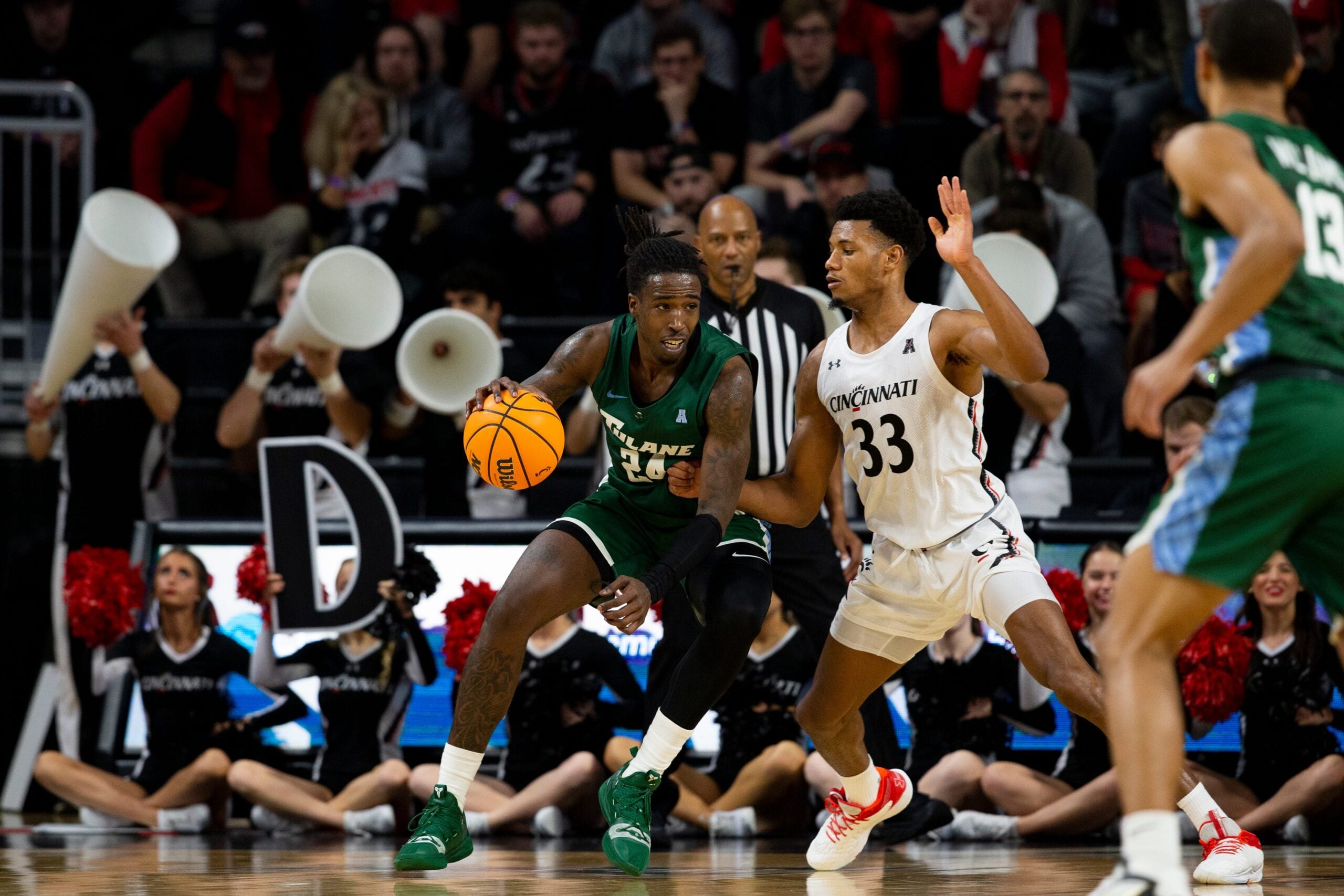 Cincinnati Bearcats forward Ody Oguama (33) guards Tulane Green Wave forward Kevin Cross (24) during the second half of an NCAA men   s college basketball game on Thursday, Dec. 29, 2022, at Fifth Third Arena in Cincinnati. The Bearcats defeated the Green Wave 88-77 with a crowd of 9,484.

Tulane Green Wave At Cincinnati Bearcats Ncaa Basketball Dec 29
