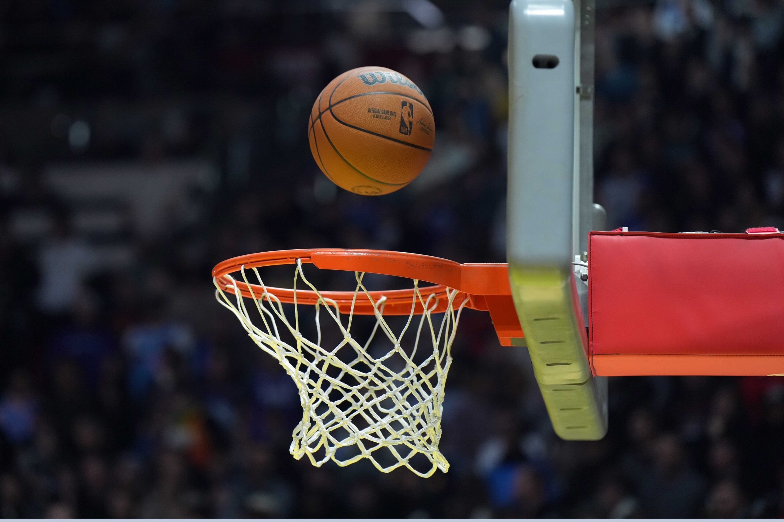 Feb 18, 2023; Salt Lake City, UT, USA; A Wilson official NBA logo basketball swishes through the net at Huntsman Center. Mandatory Credit: Kirby Lee-Imagn Images