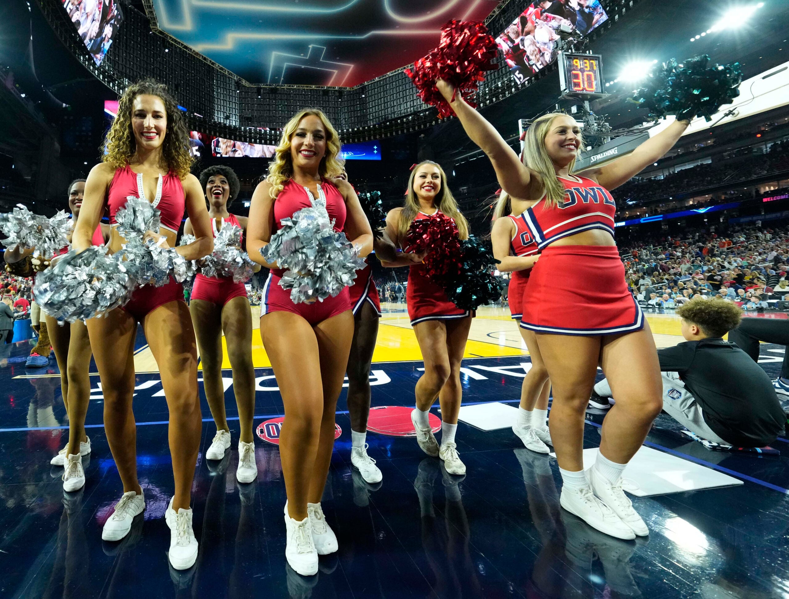 Apr 1, 2023; Houston, TX, USA; Florida Atlantic Owls cheerleaders perform in the semifinals of the Final Four of the 2023 NCAA Tournament against the San Diego State Aztecs at NRG Stadium. Mandatory Credit: Robert Deutsch-Imagn Images