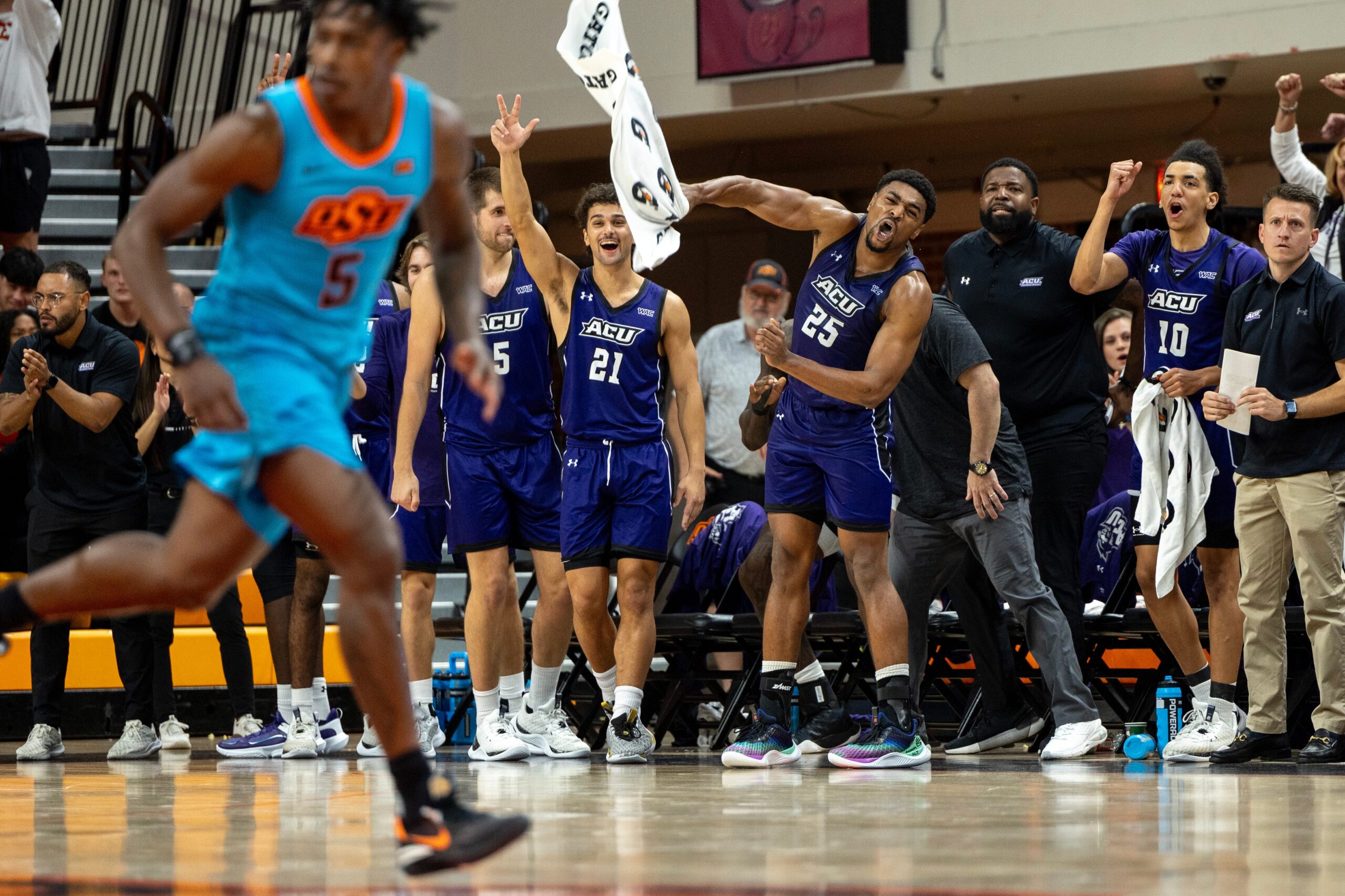 Abilene Christian forward Cameron Steele (5), guard Hunter Jack Madden (21), guard Immanuel Allen (25) and guard Nasir DeGruy (10) celebrate on the second half of an NCAA men  s college basketball game Monday, Nov. 6, 2023., in Stillwater, Okla. (Mitch Alcala for the Oklahoman)