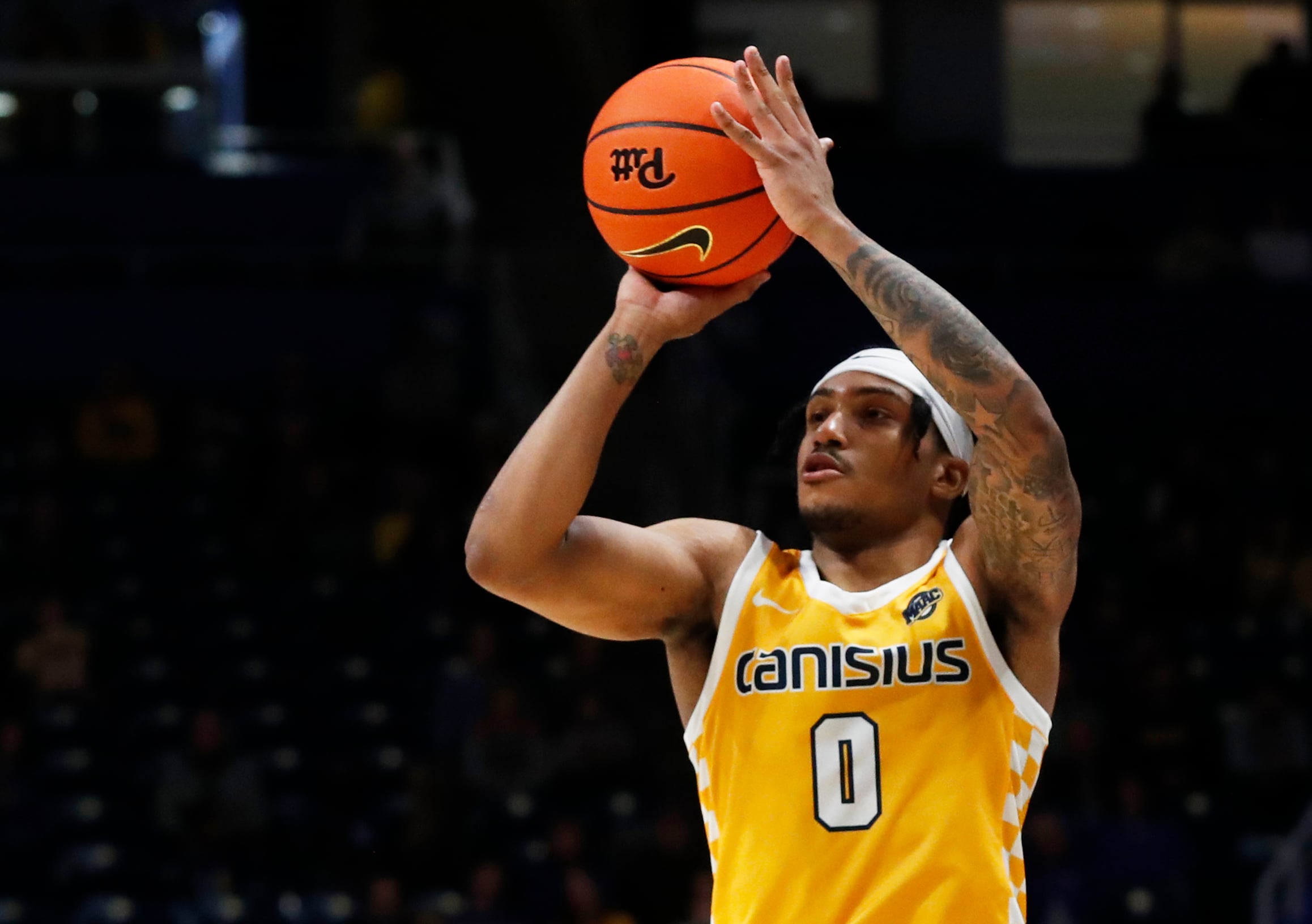 Dec 9, 2023; Pittsburgh, Pennsylvania, USA;  Canisius Golden Griffins guard Tre Dinkins (0) shoots against the Pittsburgh Panthers during the second half at the Petersen Events Center. Pittsburgh won 82-71. Mandatory Credit: Charles LeClaire-Imagn Images