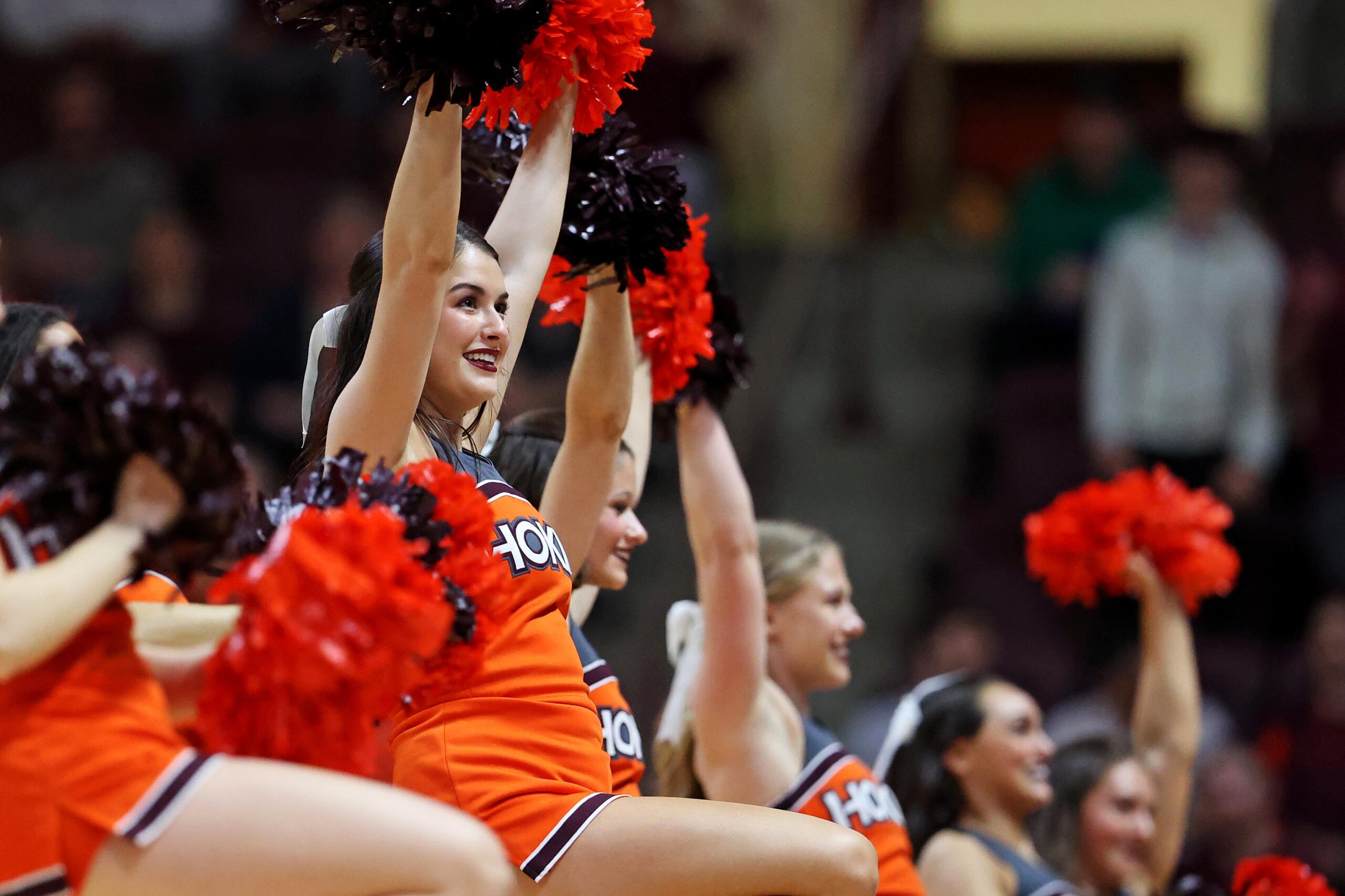 Mar 2, 2024; Blacksburg, Virginia, USA; Virginia Tech Hokies cheerleaders perform during a time out of the game between the Virginia Tech Hokies and the Wake Forest Demon Deacons at Cassell Coliseum. Mandatory Credit: Peter Casey-Imagn Images