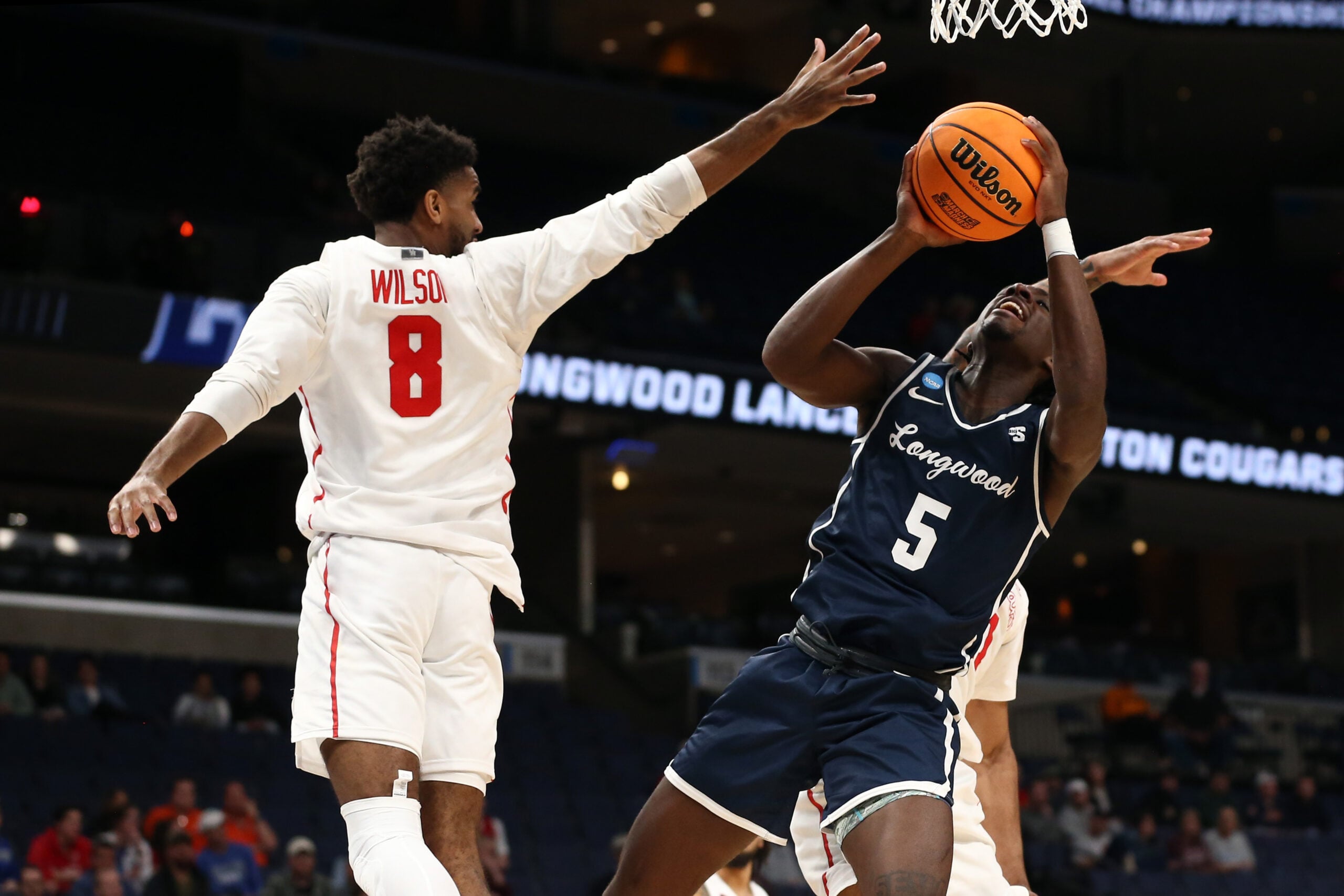 Mar 22, 2024; Memphis, TN, USA; Longwood Lancers guard Johnathan Massie (5) shoots as Houston Cougars guard Mylik Wilson (8) defends during the second half in the NCAA Tournament First Round at FedExForum. Mandatory Credit: Petre Thomas-Imagn Images