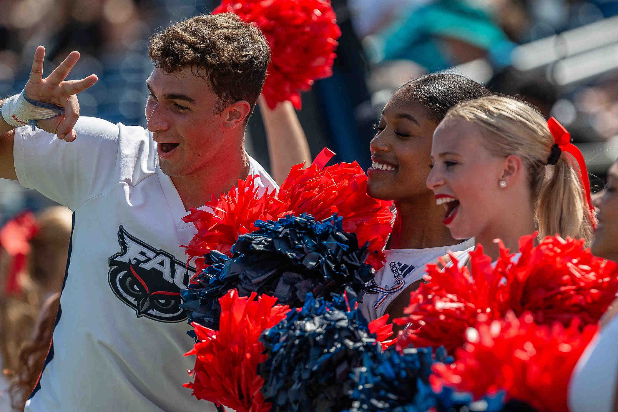 FAU cheerleader pose for television cameras during NCAA college football action as the Florida Atlantic University Owls host Army's Black Knights on September 7, 2024, in Boca Raton, Fla. Army won the contest.