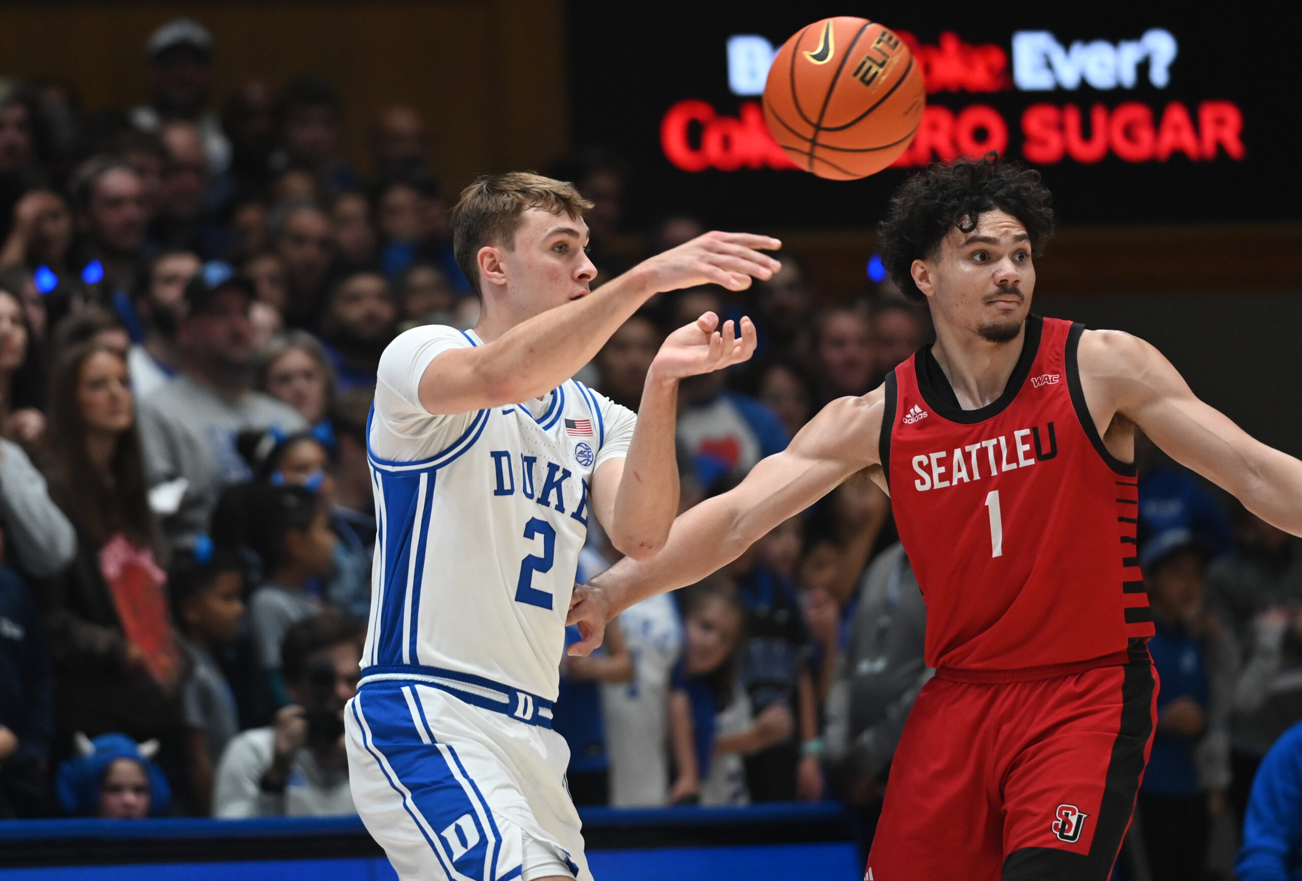 Nov 29, 2024; Durham, North Carolina, USA;  Duke Blue Devils forward Cooper Flagg (2) throws a pass in front of Seattle Redhawks guard Maleek Arington (1) during the first half at Cameron Indoor Stadium. Mandatory Credit: Rob Kinnan-Imagn Images