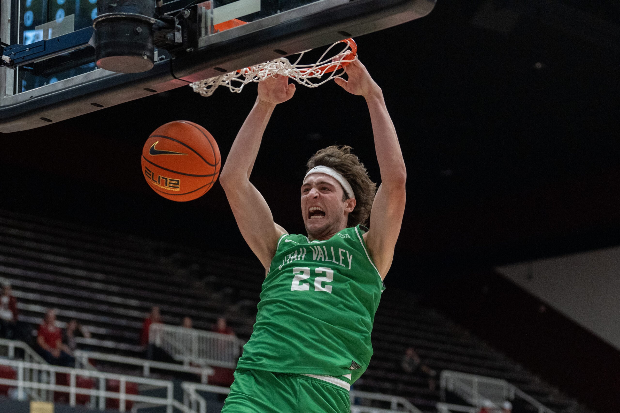 Dec 3, 2024; Stanford, California, USA; Utah Valley Wolverines forward Carter Welling (22) dunks the basketball against the Stanford Cardinal during the second half at Maples Pavilion. Mandatory Credit: Neville E. Guard-Imagn Images