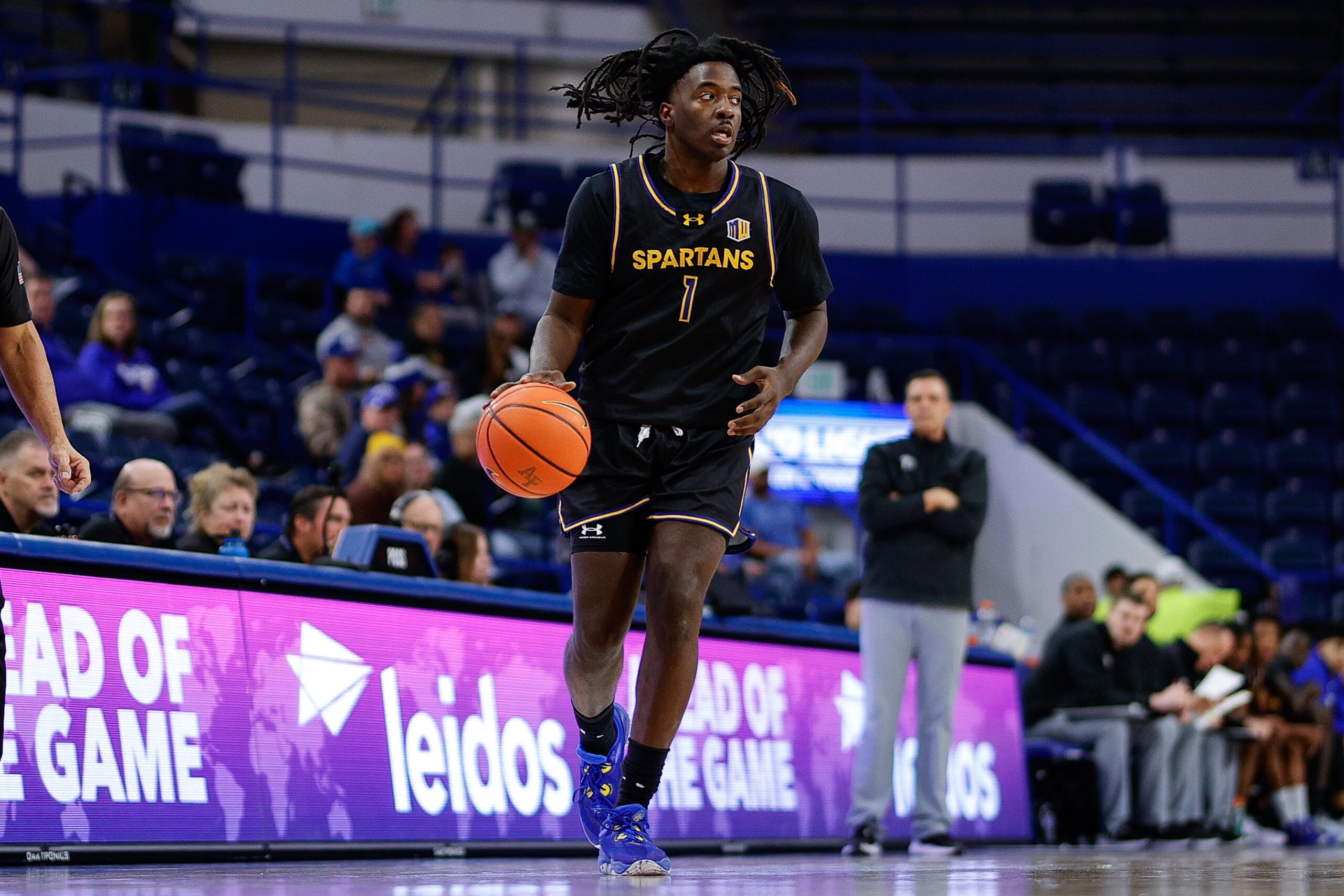 Jan 11, 2025; Colorado Springs, Colorado, USA; San Jose State Spartans guard Will McClendon (1) controls the ball in the first half against the Air Force Falcons at Clune Arena. Mandatory Credit: Isaiah J. Downing-Imagn Images
