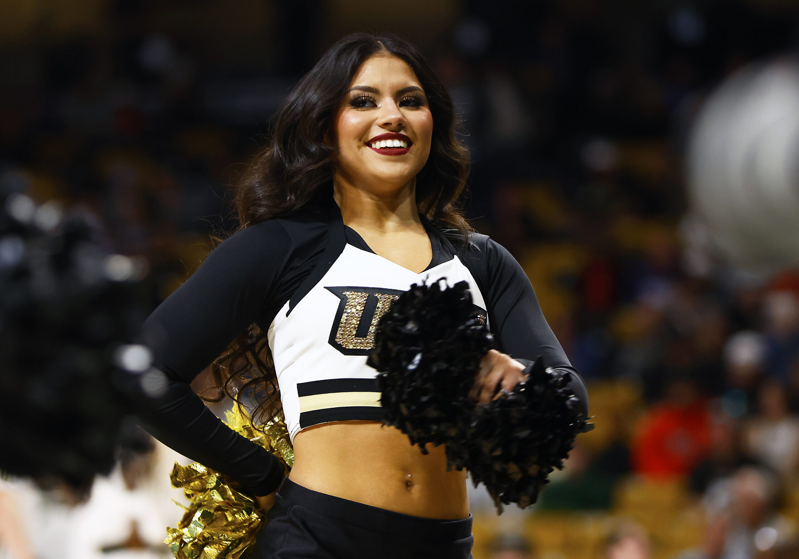 Jan 25, 2025; Orlando, Florida, USA;  A Central Florida Knights cheerleader performs during a game against the Texas Christian Horned Frogs at Addition Financial Arena. Mandatory Credit: Russell Lansford-Imagn Images