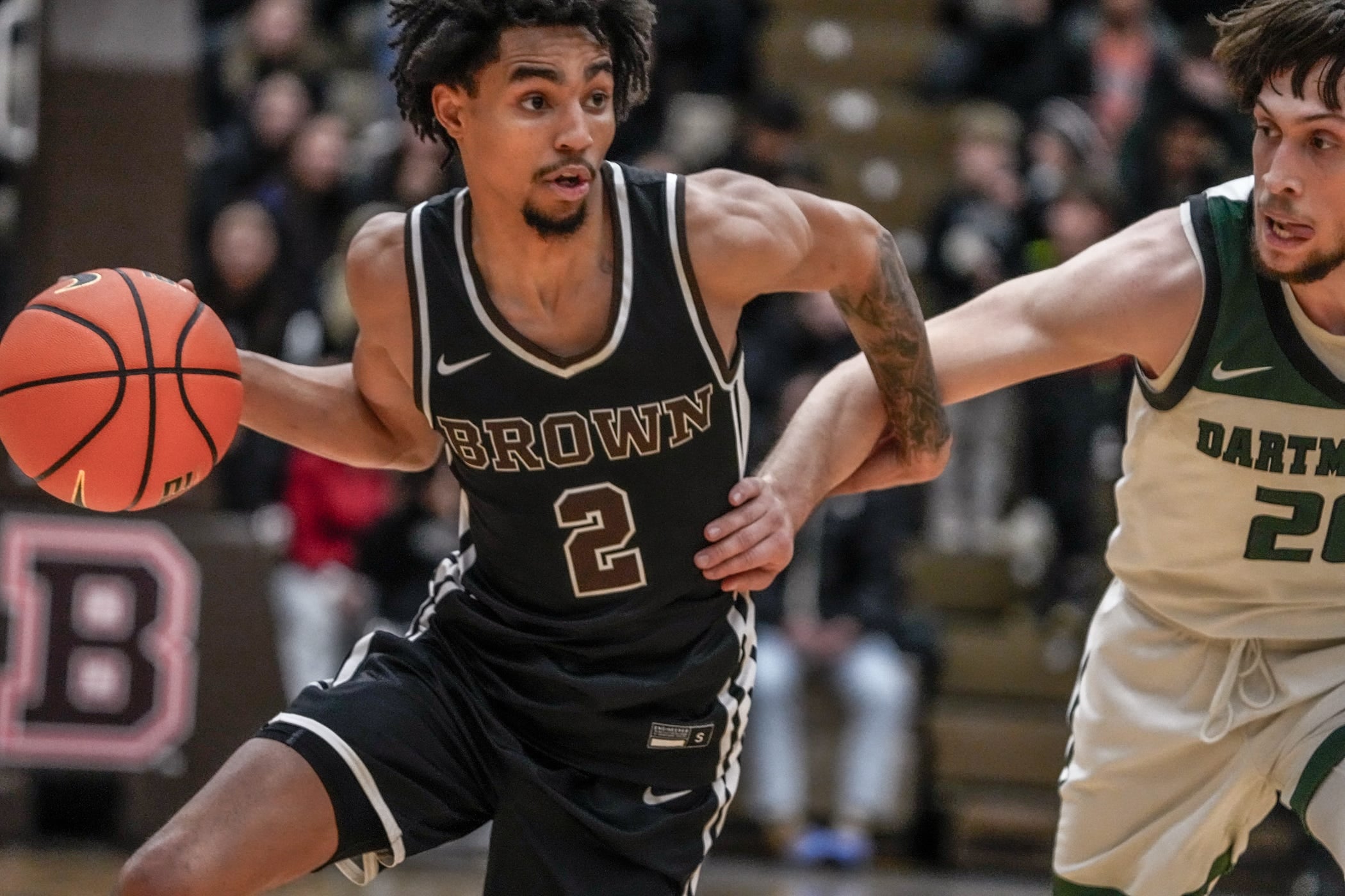 Brown falls to Dartmouth 84-83 at Pizzitola Sports Center. Bear's Jeremiah Jenkins drives by Romeo Myrthil