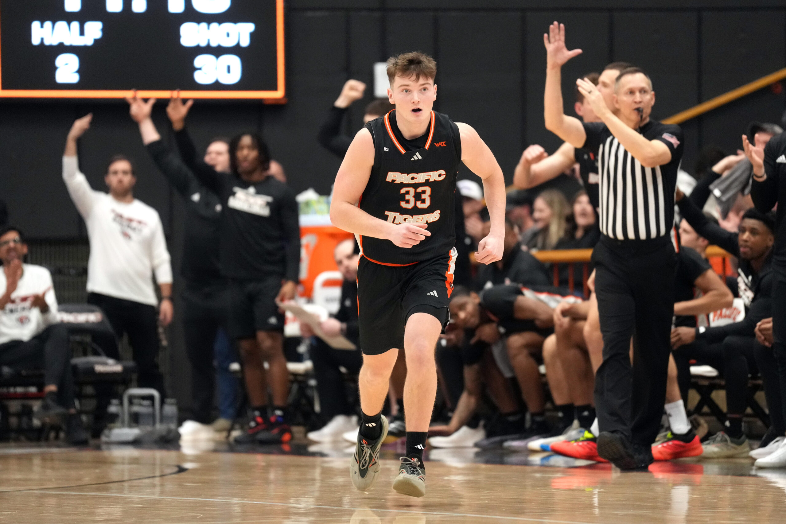 Feb 8, 2025; Stockton, California, USA; Pacific Tigers guard Carter Benton (33) reacts after making a three point basket against the Gonzaga Bulldogs during the second half at Alex G. Spanos Center. Mandatory Credit: Darren Yamashita-Imagn Images