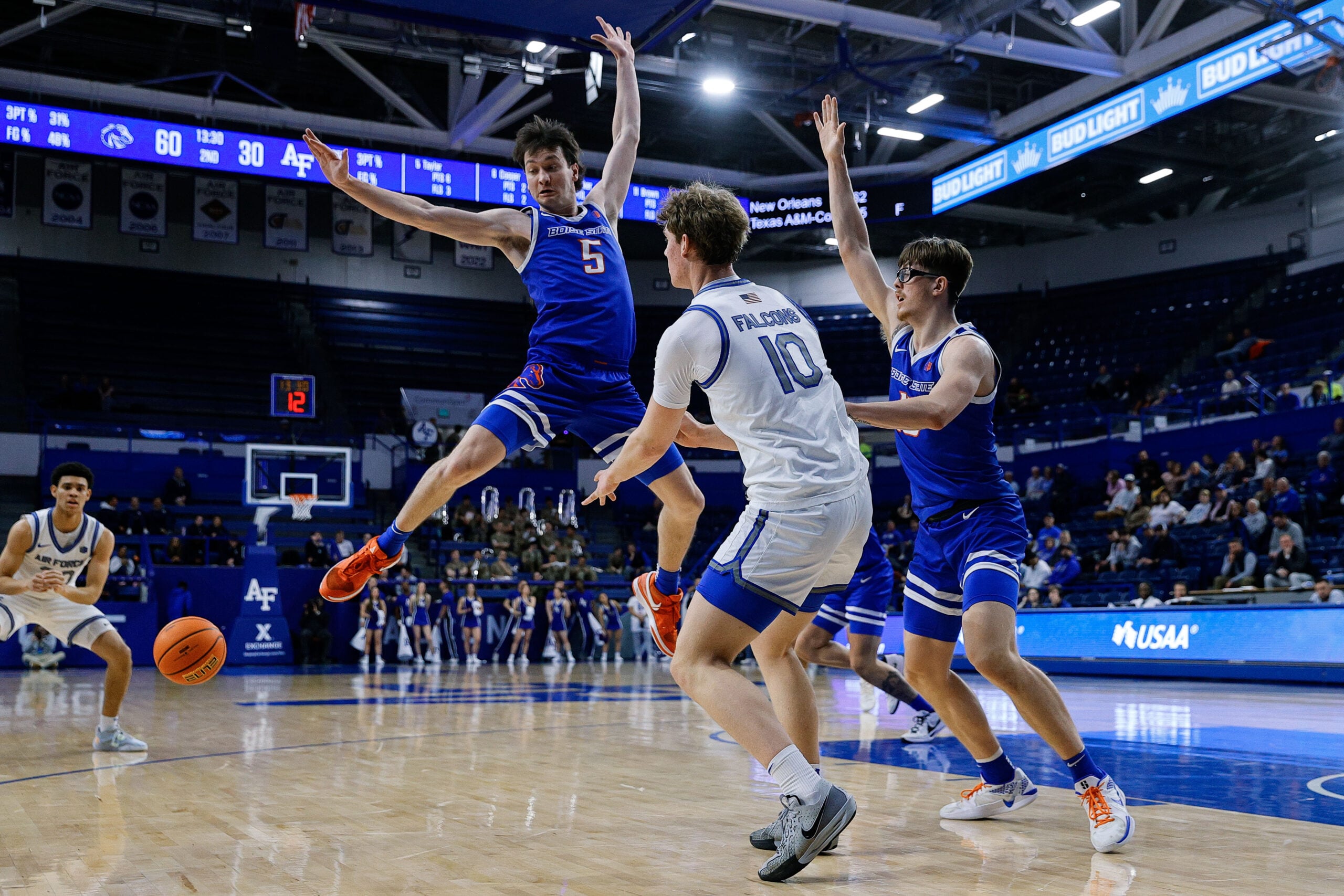 Mar 4, 2025; Colorado Springs, Colorado, USA; Air Force Falcons forward Caleb Walker (10) passes the ball as Boise State Broncos guard RJ Keene II (5) and forward Andrew Meadow (13) defend in the second half at Clune Arena. Mandatory Credit: Isaiah J. Downing-Imagn Images