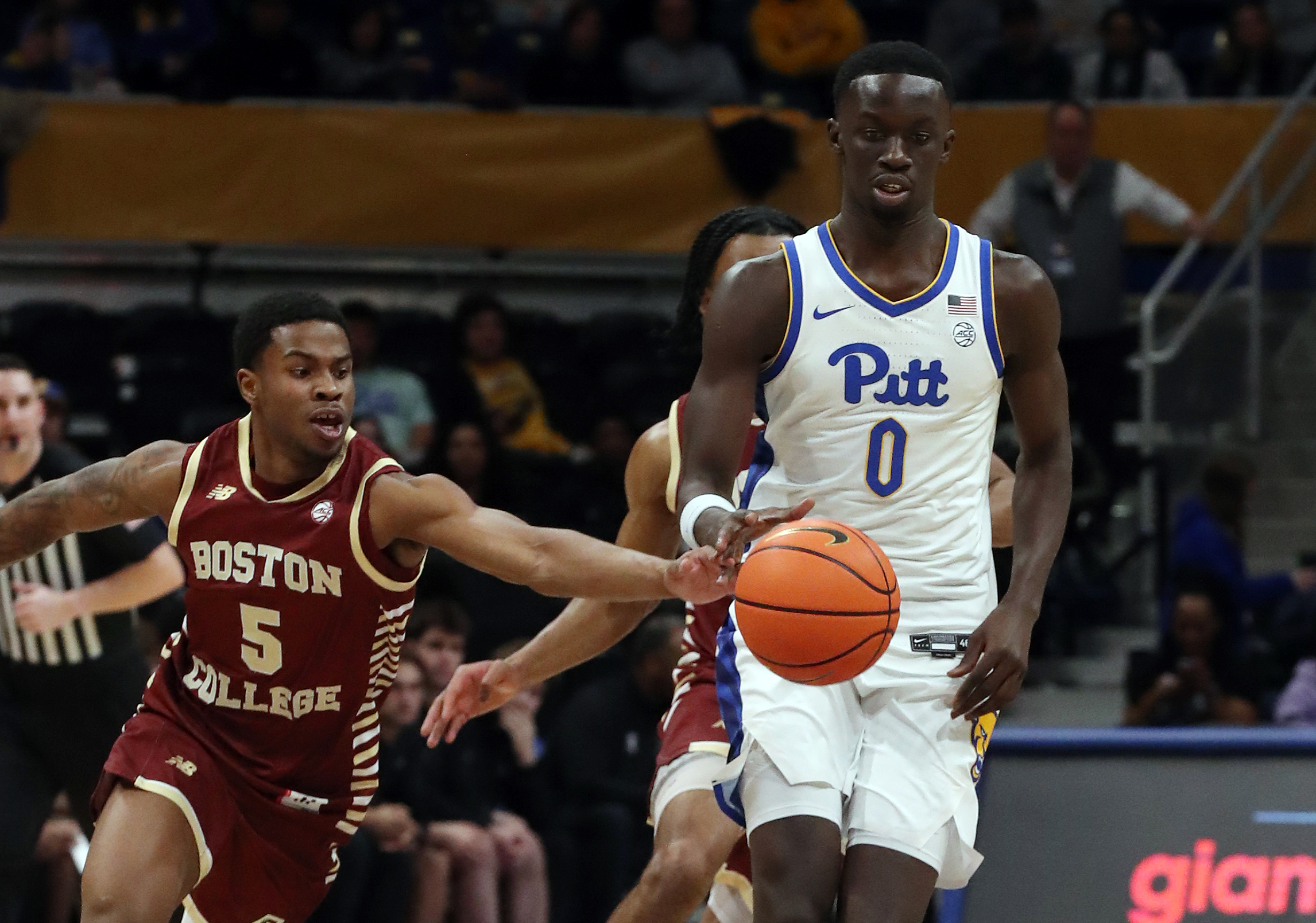 Mar 8, 2025; Pittsburgh, Pennsylvania, USA;  Boston College Eagles guard Fred Payne (5) steals the ball from Pittsburgh Panthers forward Amdy Ndiaye (0) during the second half at the Petersen Events Center. Mandatory Credit: Charles LeClaire-Imagn Images