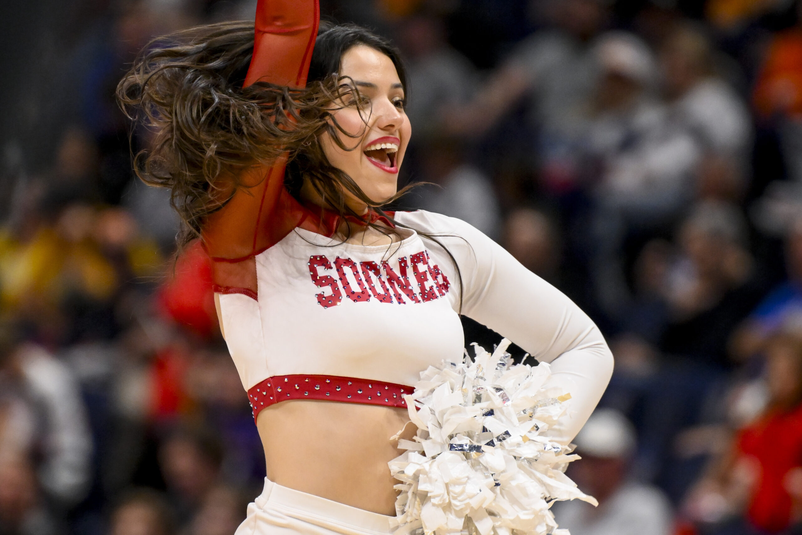 Mar 12, 2025; Nashville, TN, USA;  Oklahoma Sooners cheerleader during a time out against the Georgia Bulldogs during the second half at Bridgestone Arena. Mandatory Credit: Steve Roberts-Imagn Images