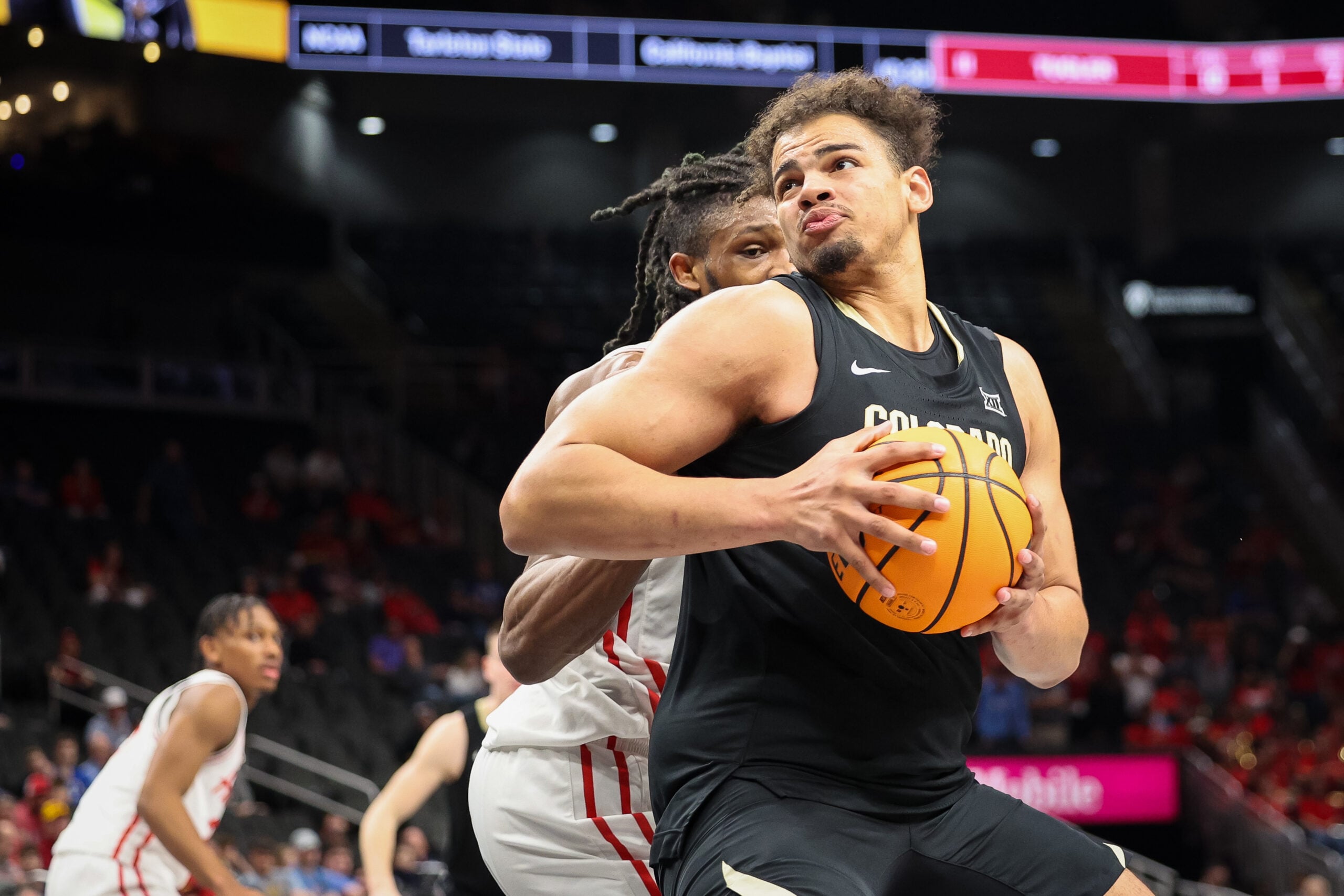 Mar 13, 2025; Kansas City, MO, USA; Colorado Buffaloes center Elijah Malone (50) drives to the basket during the second half against the Houston Cougars at T-Mobile Center. Mandatory Credit: William Purnell-Imagn Images
