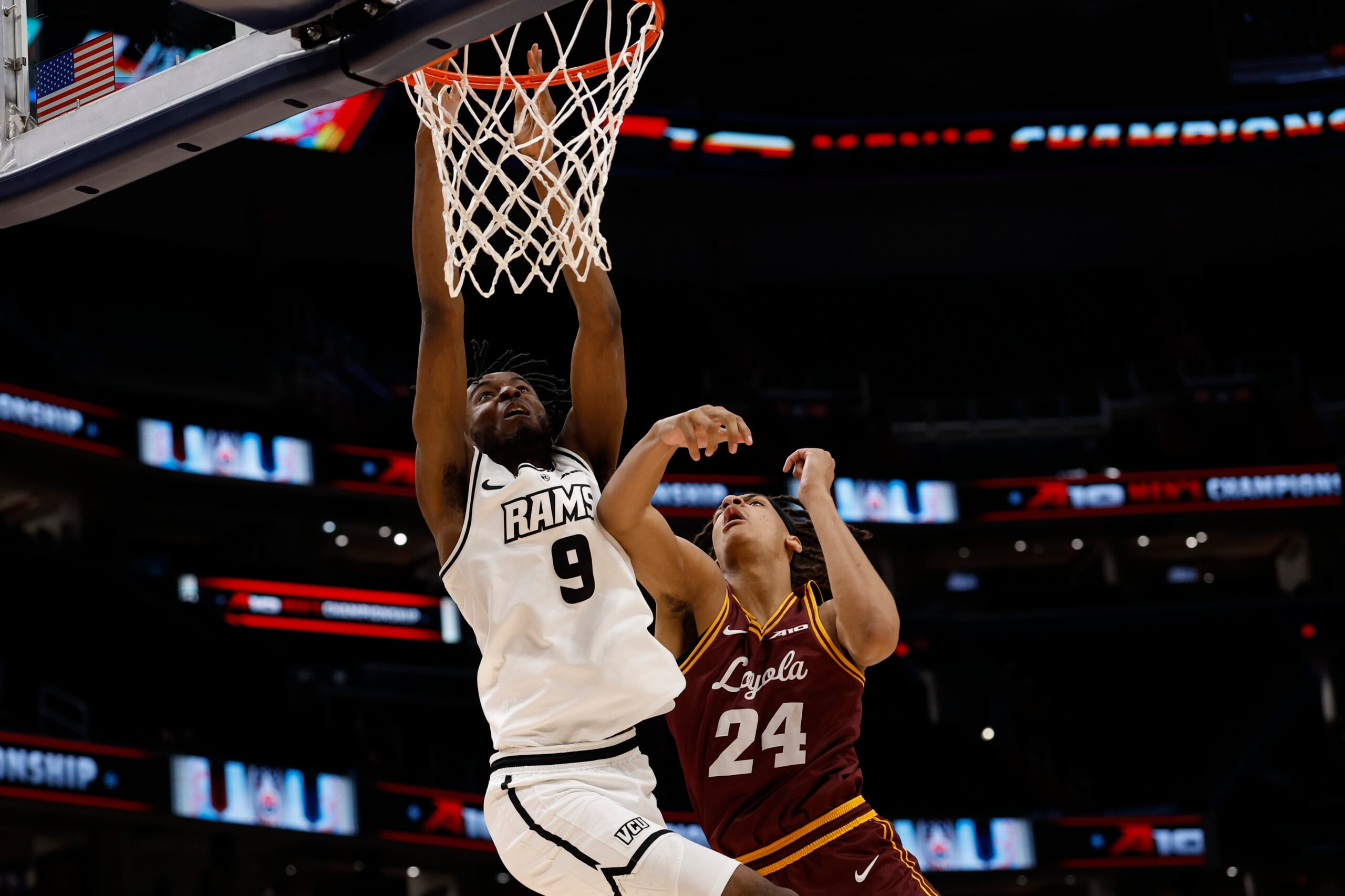 Mar 15, 2025; Washington, D.C., USA; VCU Rams forward Luke Bamgboye (9) is fouled while attempting to dunk the ball by Loyola Chicago Ramblers center Miles Rubin (24) in the second half at Capital One Arena. Mandatory Credit: Geoff Burke-Imagn Images