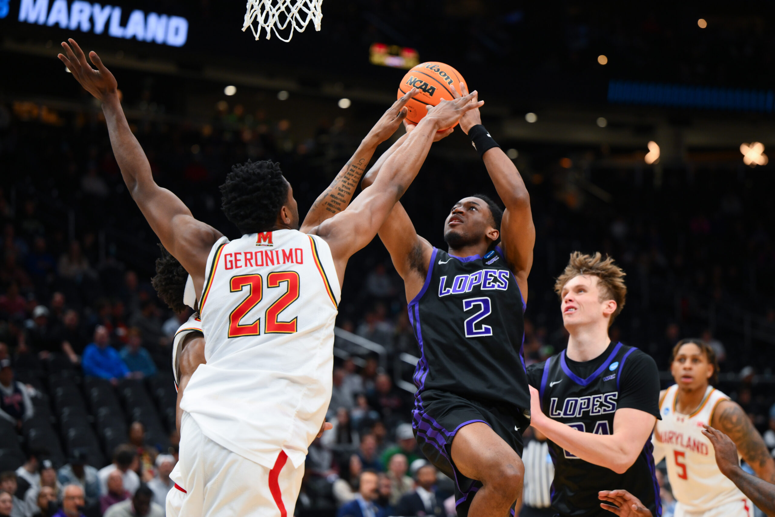 Mar 21, 2025; Seattle, WA, USA; Grand Canyon Antelopes guard Makaih Williams (2) shoots the ball while being defended by Maryland Terrapins forward Jordan Geronimo (22) in the second half at Climate Pledge Arena. Mandatory Credit: Steven Bisig-Imagn Images