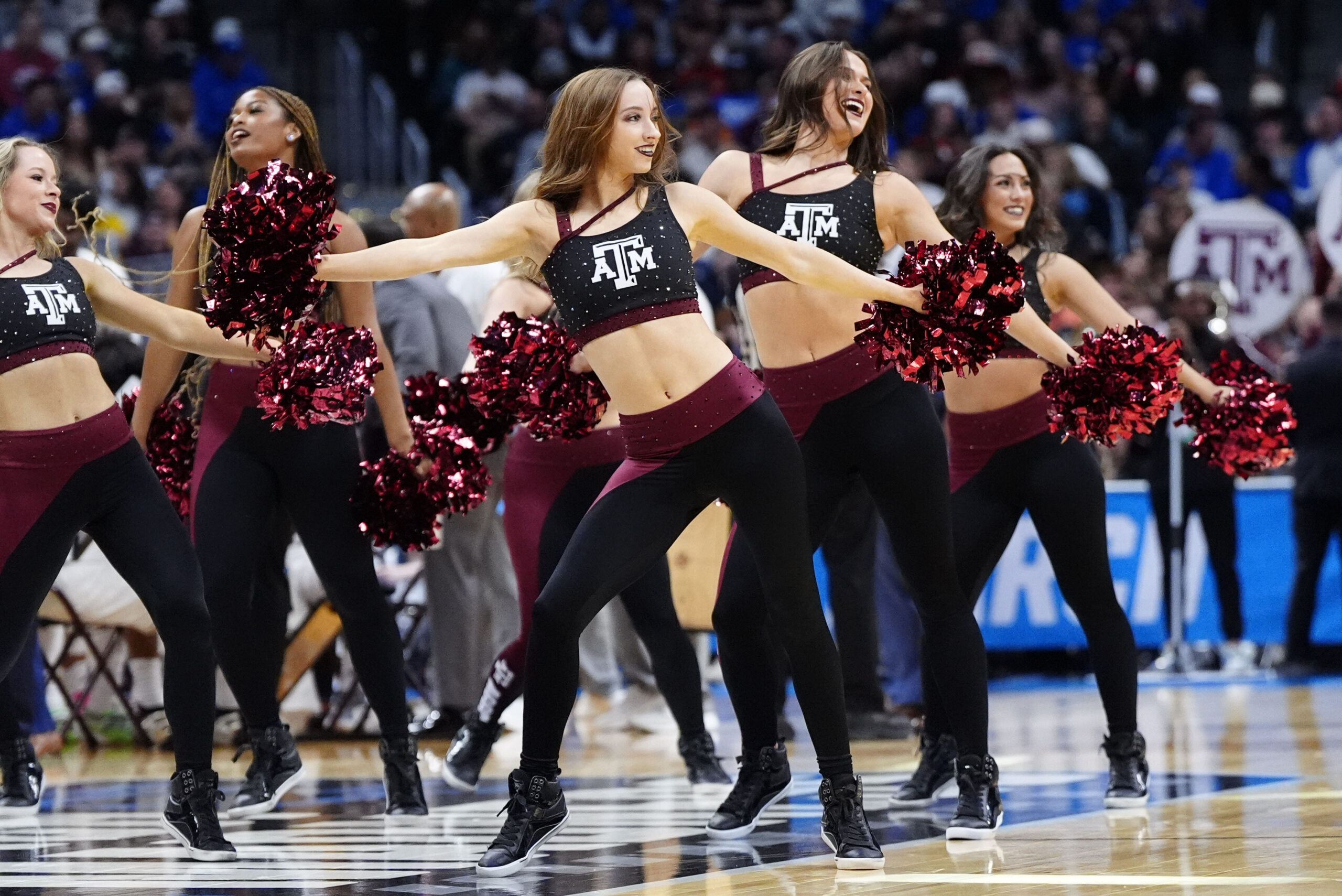 Mar 22, 2025; Denver, CO, USA; Texas A&M Aggies cheerleaders perform during the first half in the second round of the NCAA Tournament  at Ball Arena. Mandatory Credit: Ron Chenoy-Imagn Images
