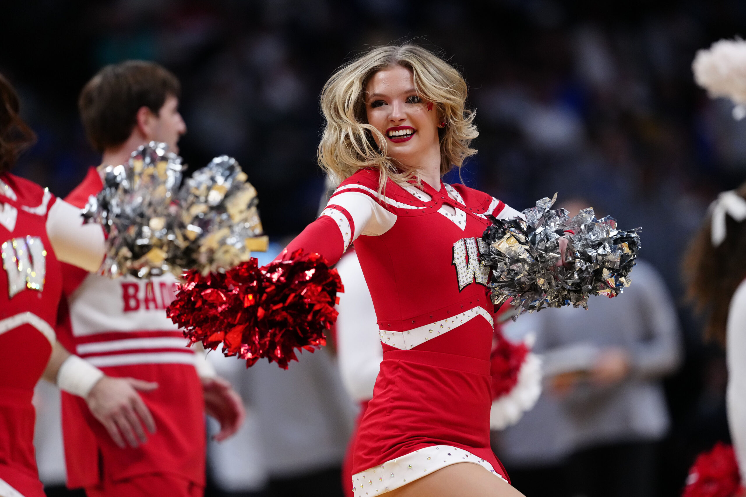Mar 22, 2025; Denver, CO, USA; The Wisconsin Badgers cheerleaders perform during the first half in the second round of the NCAA Tournament  at Ball Arena. Mandatory Credit: Ron Chenoy-Imagn Images
