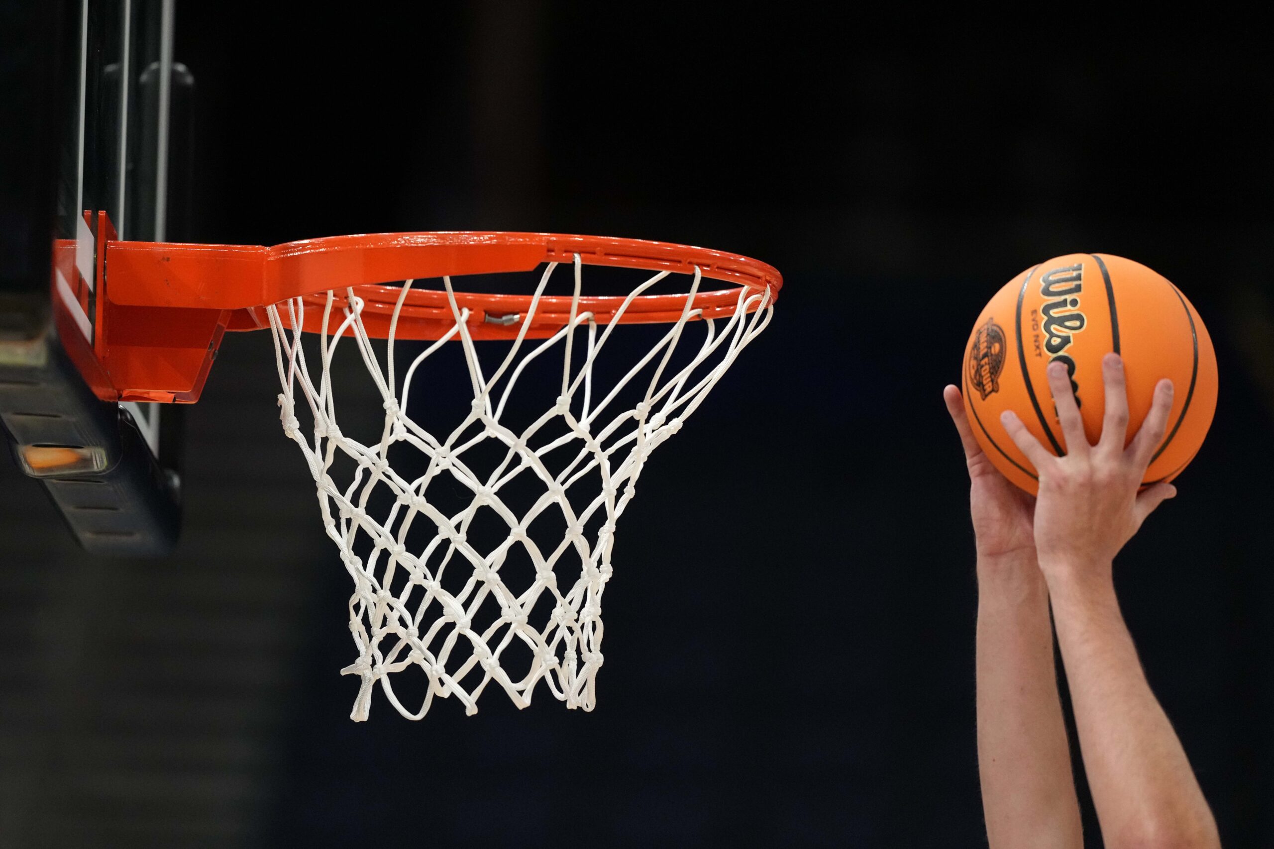 Apr 3, 2025; Tampa, FL, USA; A Wilson EVO Nxt basketball ball with the 2025 NCAA Women's Final Four logo approaches the rim and the net at Amalie Arena. Mandatory Credit: Kirby Lee-Imagn Images