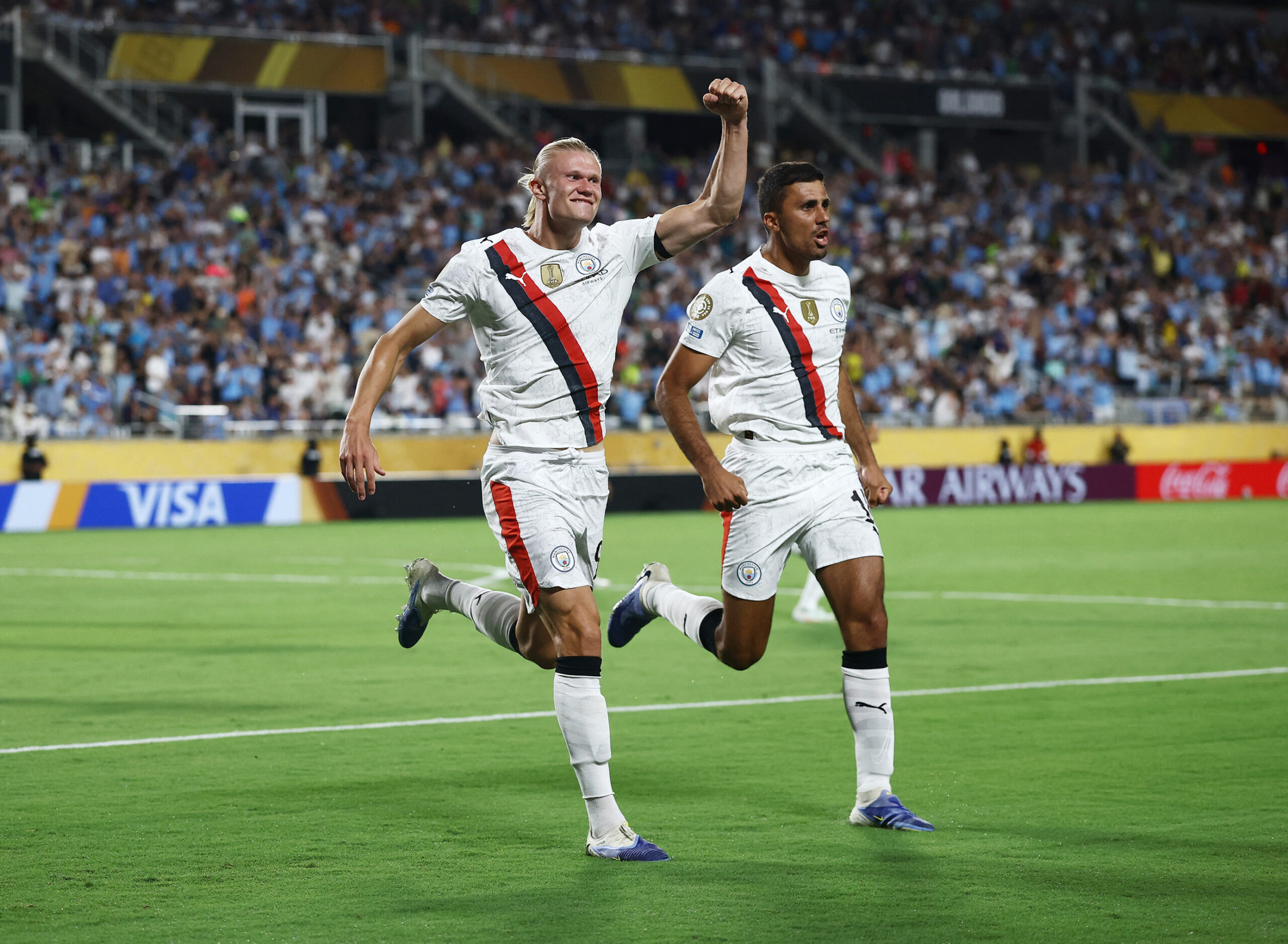 [Subscription Customers Only] Jun 30, 2025; Orlando, Florida, USA; Manchester City forward Erling Haaland (9) celebrates scoring their second goal with midfielder Rodri (16) during a round of 16 match of the 2025 FIFA Club World Cup at Camping World Stadium. Mandatory Credit: Lee Smith-Reuters via Imagn Images