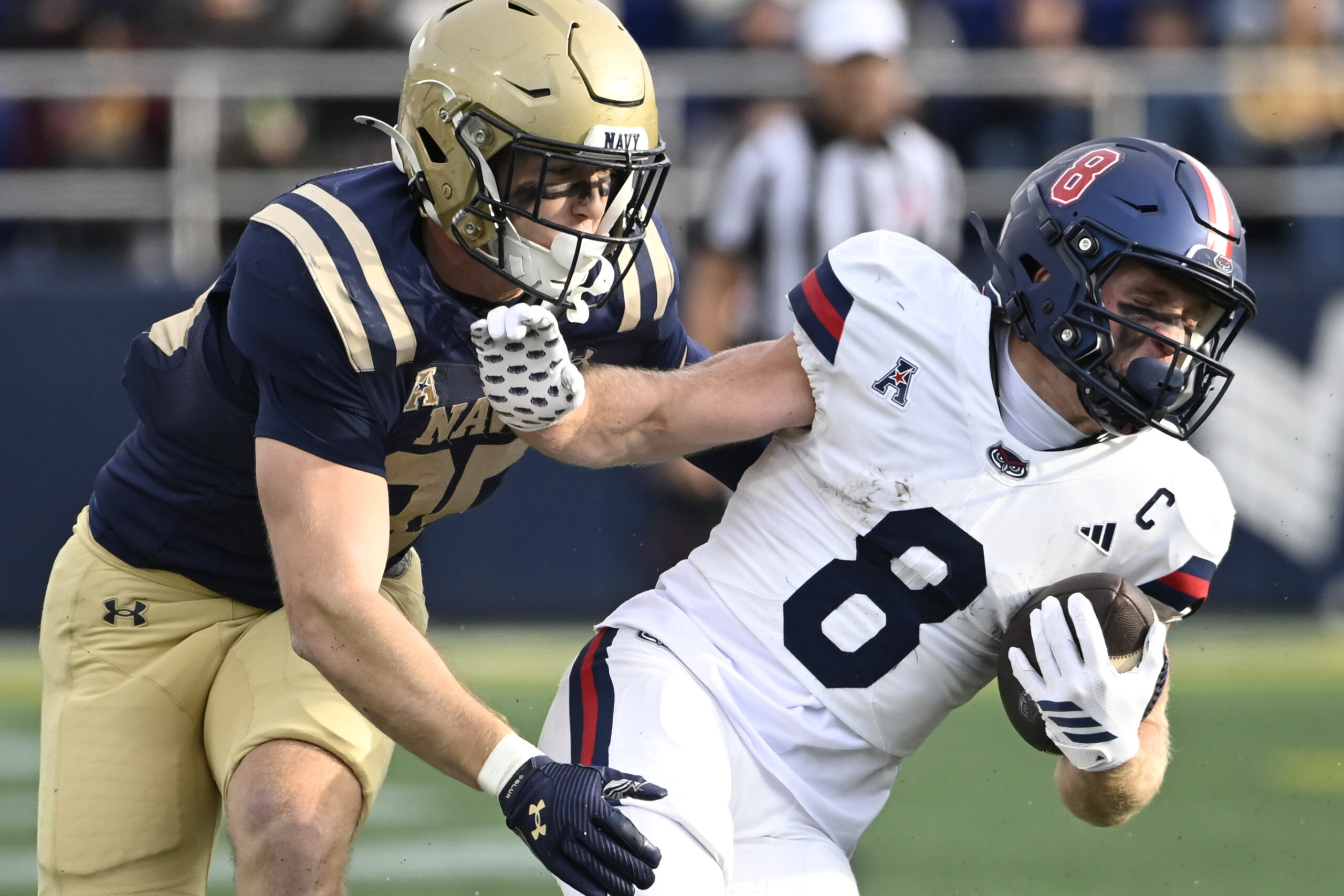 Oct 25, 2025; Annapolis, Maryland, USA;  Florida Atlantic Owls wide receiver Easton Messer (8) makes a move on Navy Midshipmen linebacker Luke Pirris (35) during the first half at Navy-Marine Corps Memorial Stadium. Mandatory Credit: Tommy Gilligan-Imagn Images