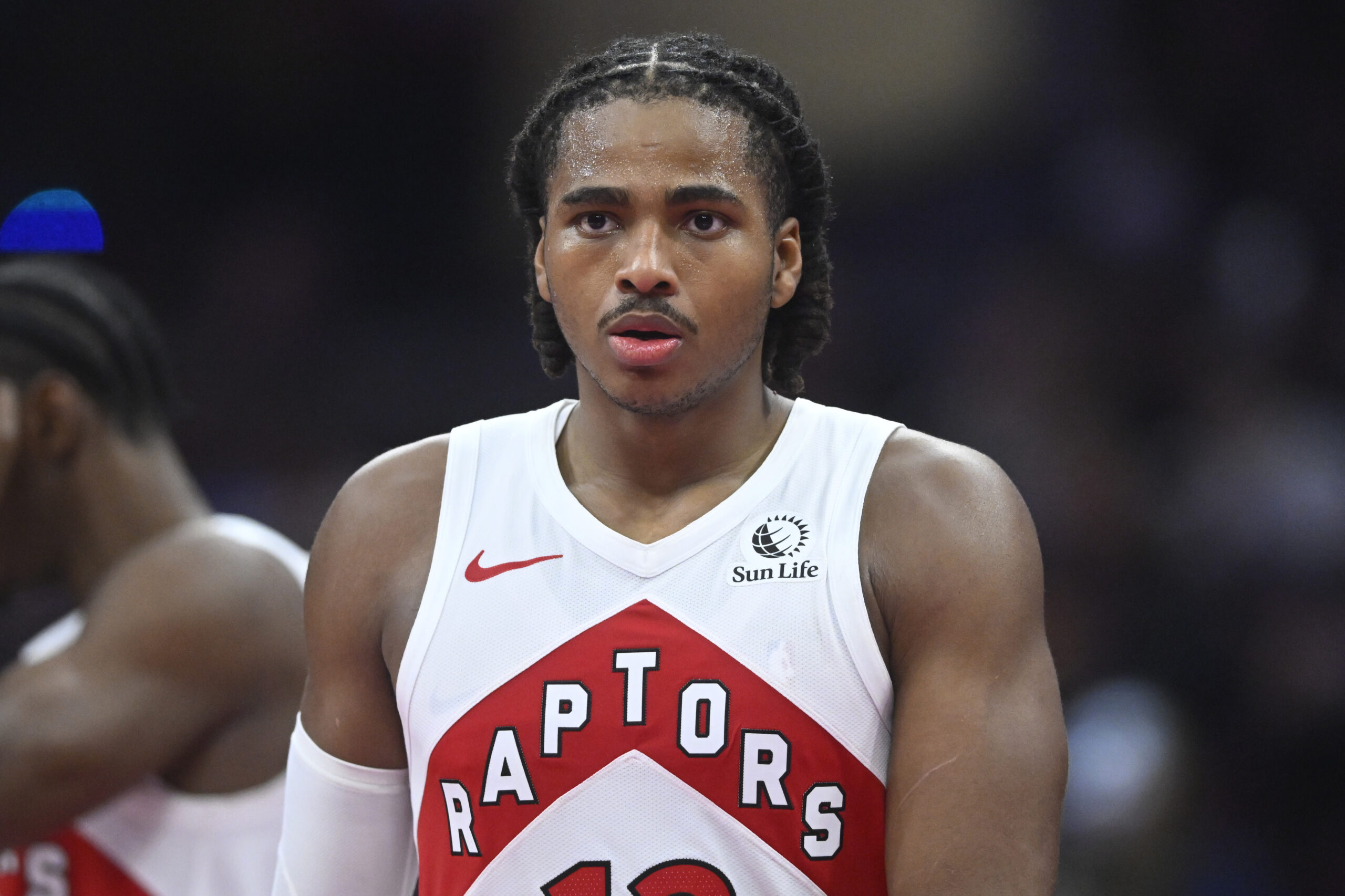 Oct 31, 2025; Cleveland, Ohio, USA; Toronto Raptors forward Collin Murray-Boyles (12) walks on the court in the third quarter against the Cleveland Cavaliers at Rocket Arena. Mandatory Credit: David Richard-Imagn Images