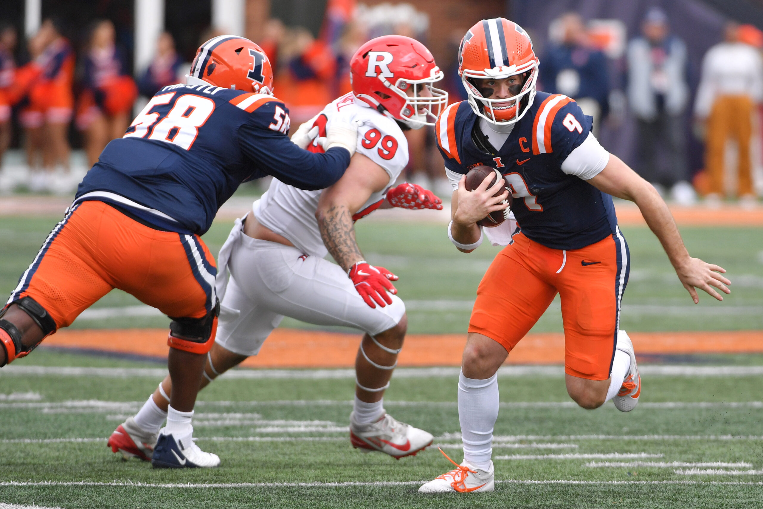 Nov 1, 2025; Champaign, Illinois, USA;  Illinois Fighting Illini quarterback Luke Altmyer (9) runs the ball during the first half against the Rutgers Scarlet Knights at Memorial Stadium. Mandatory Credit: Ron Johnson-Imagn Images