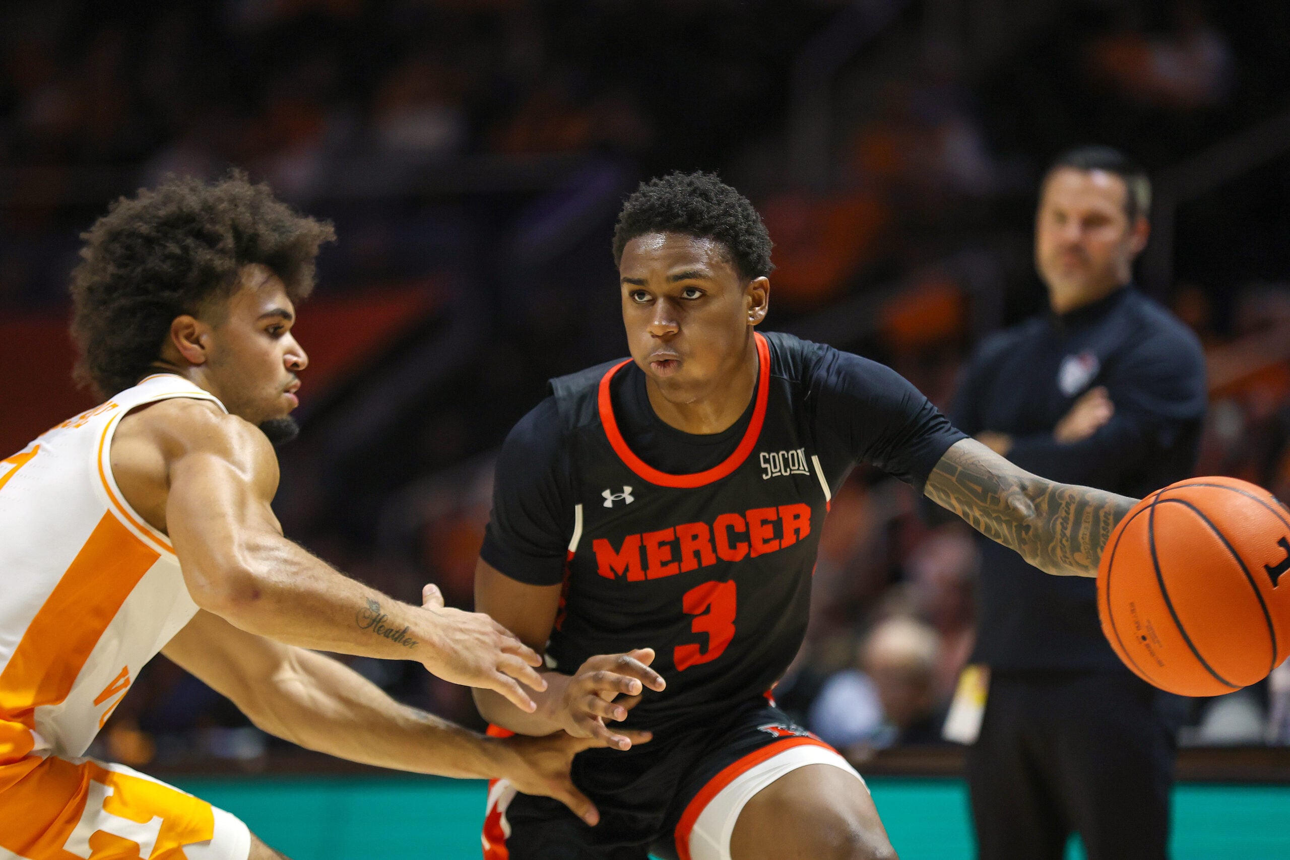 Nov 3, 2025; Knoxville, Tennessee, USA; Mercer Bears guard Quinton Perkins II (3) passes the ball against the Tennessee Volunteers during the second half at Thompson-Boling Arena at Food City Center. Mandatory Credit: Randy Sartin-Imagn Images