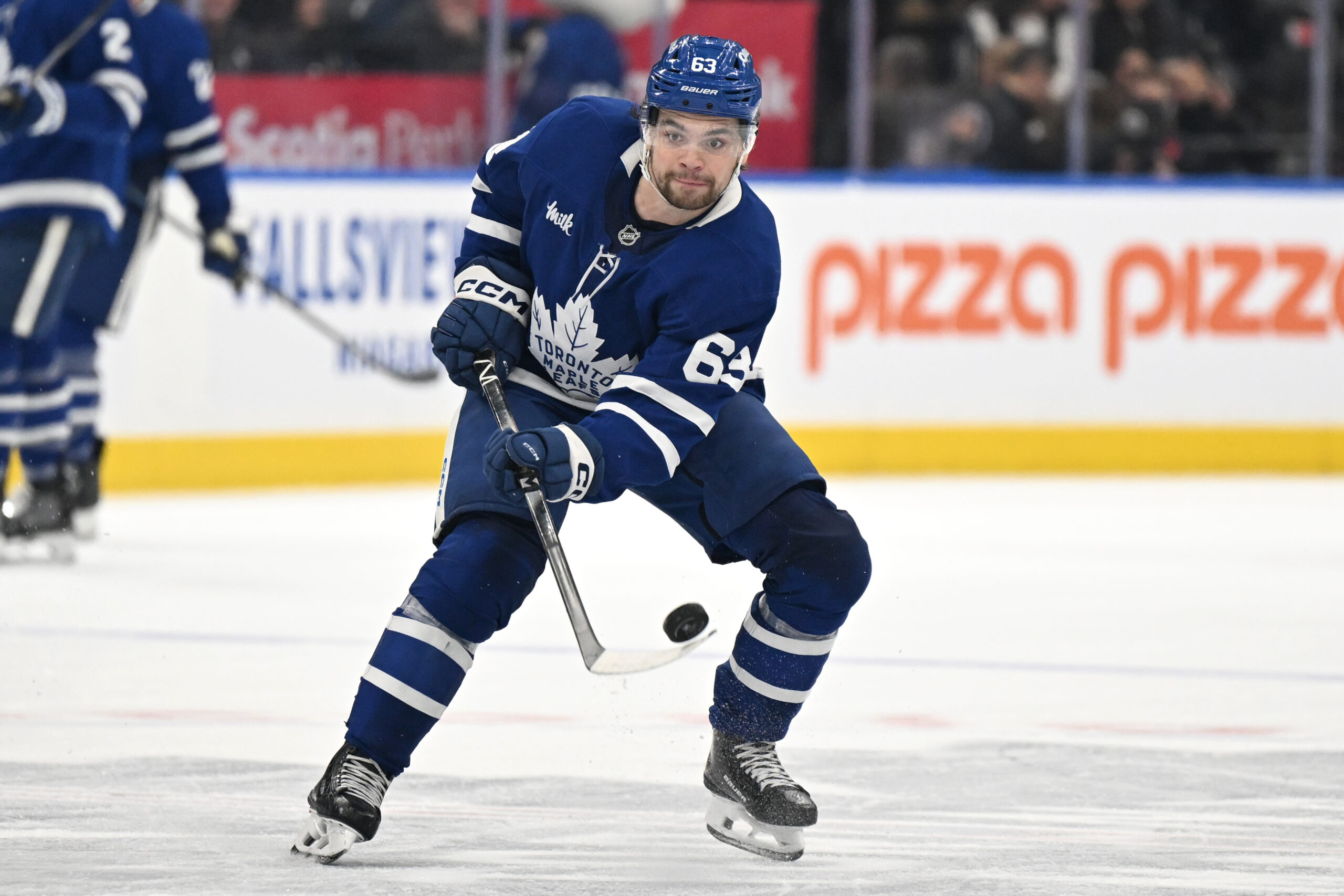Nov 8, 2025; Toronto, Ontario, CAN;  Toronto Maple Leafs forward Matias Maccelli (63) shoots the puck against the Boston Bruins in the third period at Scotiabank Arena. Mandatory Credit: Dan Hamilton-Imagn Images
