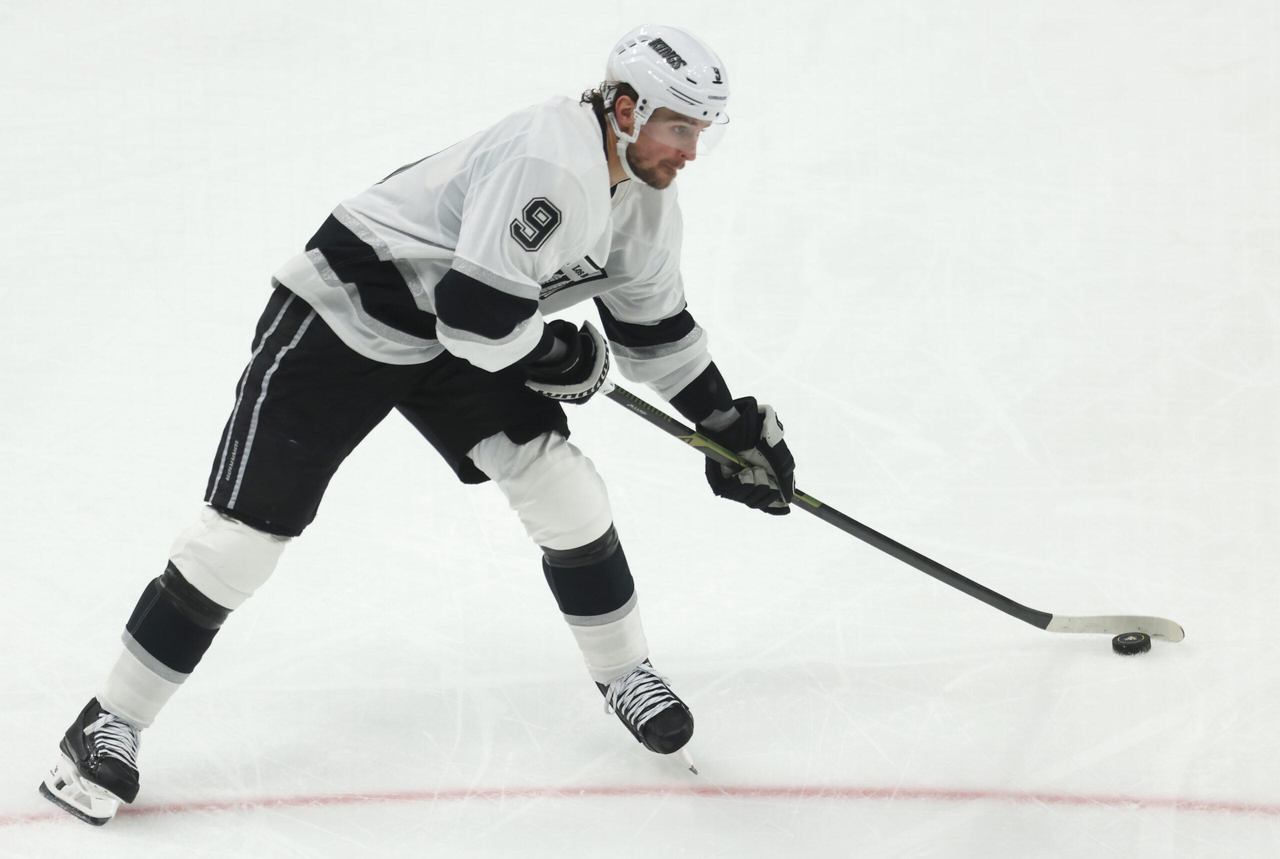 Nov 9, 2025; Pittsburgh, Pennsylvania, USA;  Los Angeles Kings right wing Adrian Kempe (9) shoots the puck against the Pittsburgh Penguins during the third period at PPG Paints Arena. Mandatory Credit: Charles LeClaire-Imagn Images